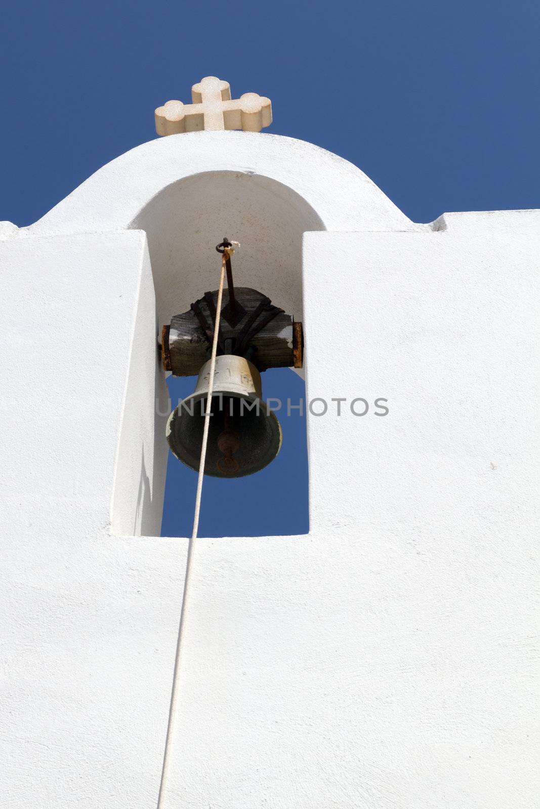 White church bell tower in greece