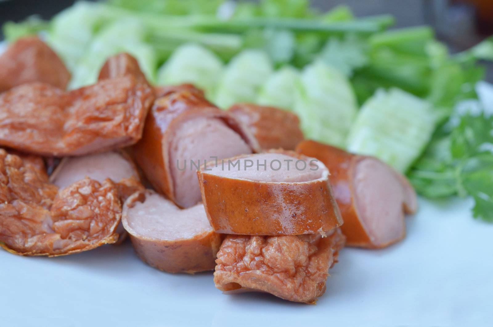 fried pork sausage served with  fresh vegetable