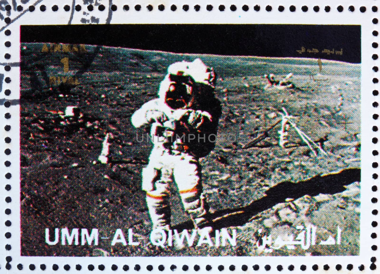 UMM AL-QUWAIN - CIRCA 1972: a stamp printed in the Umm al-Quwain shows Astronaut walks on the Surface of the Moon, Moon-landing, Apollo, circa 1972