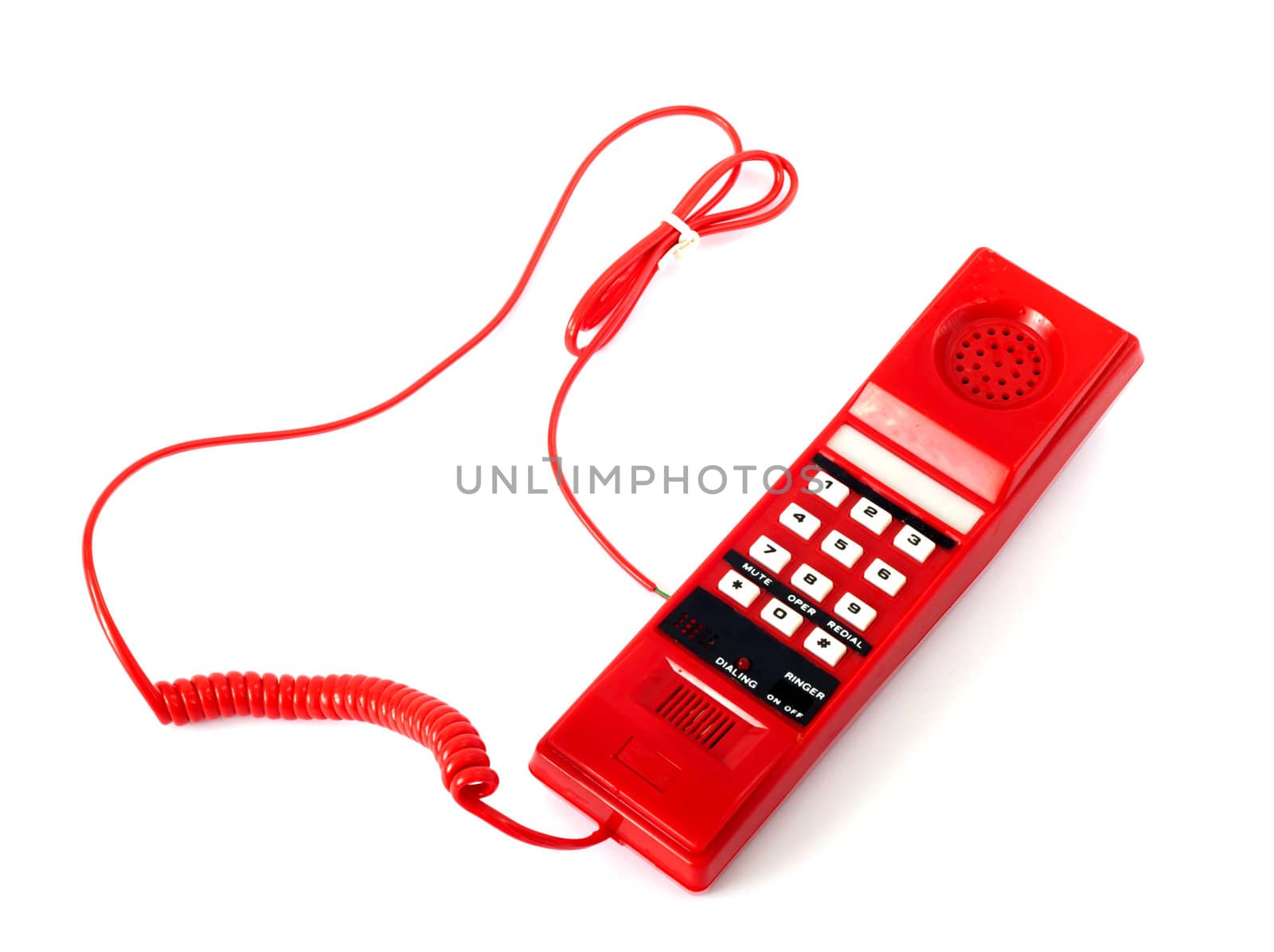 Old red telephone isolated on white background
