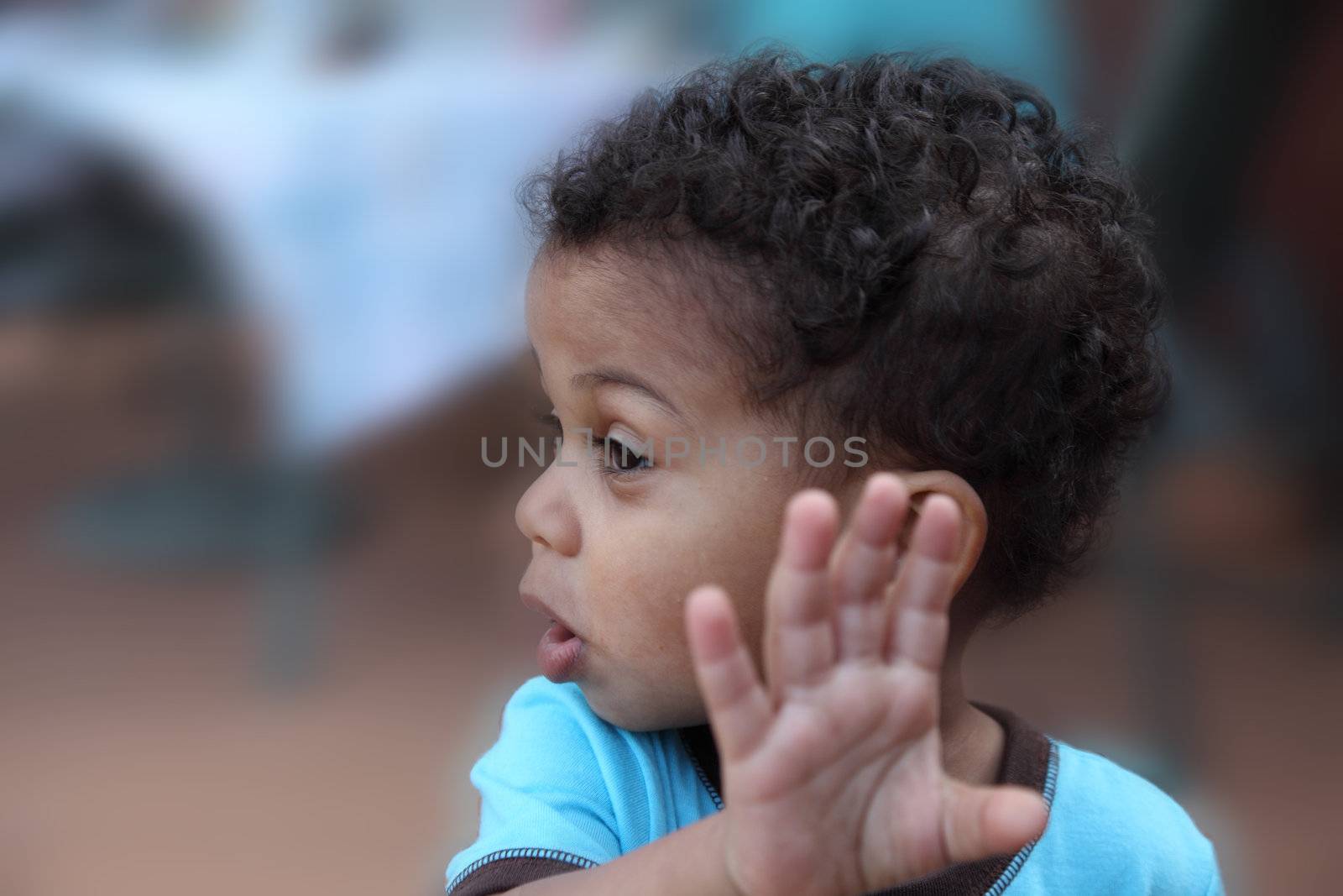 young boy indicating no with hands by njene