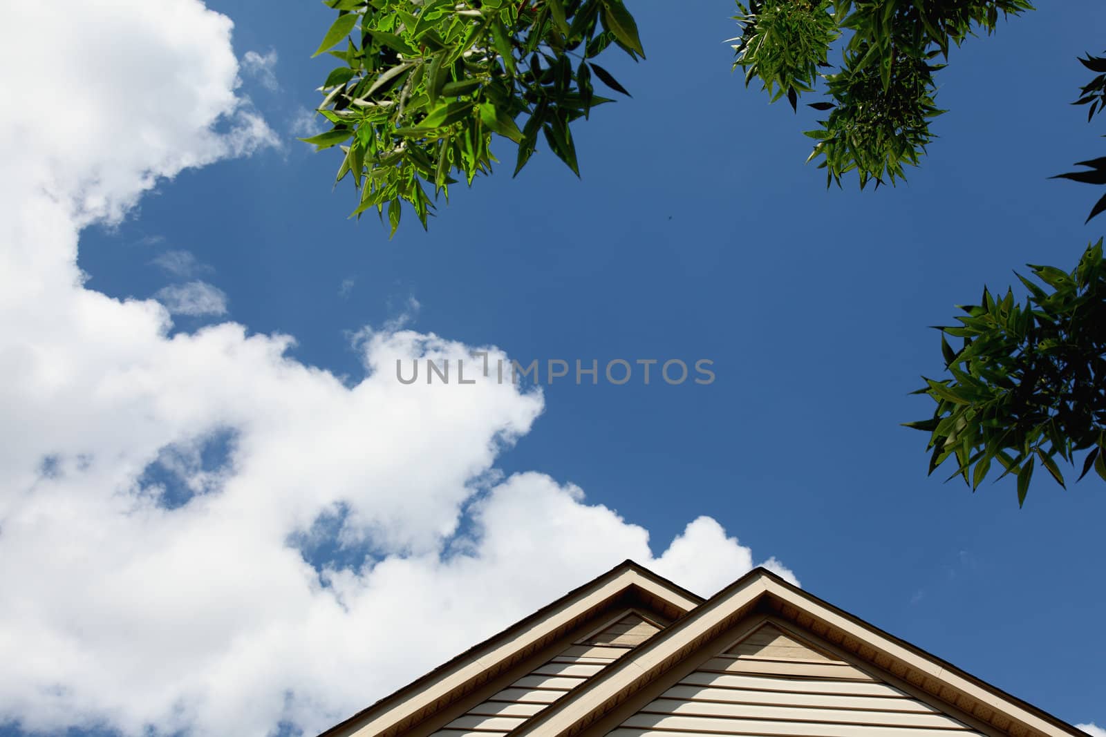 house roof peak against blue sky