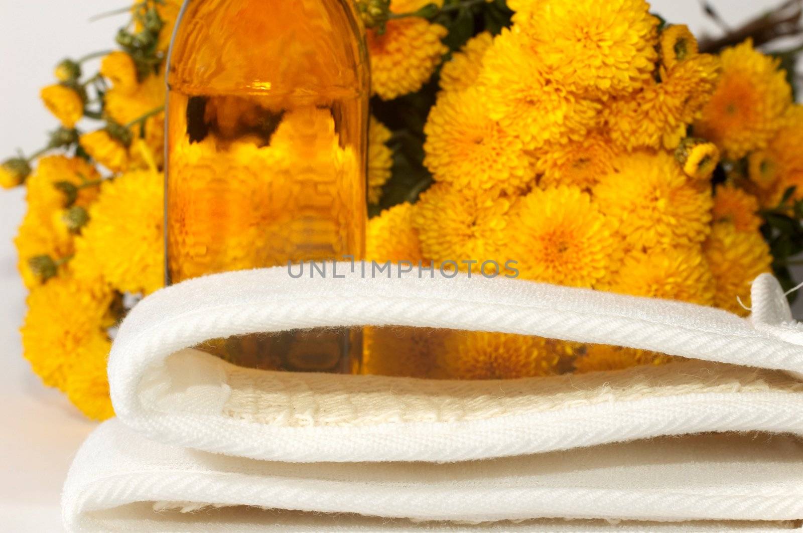 An image of oil and yellow flowers