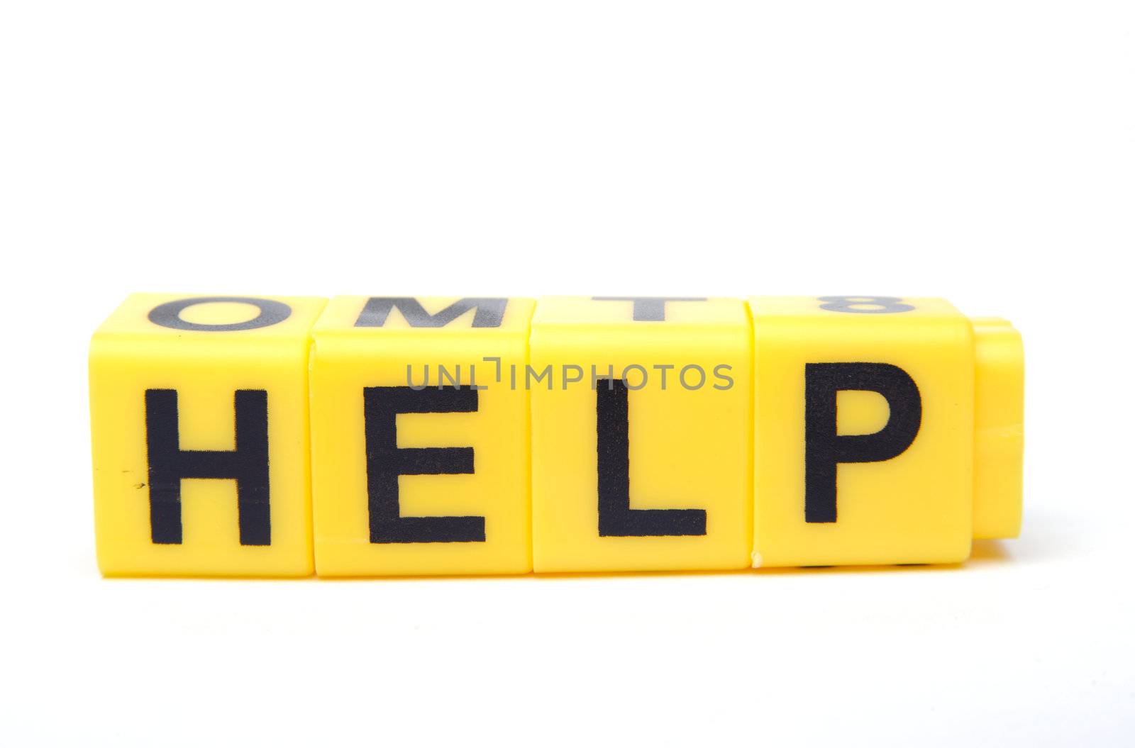 An image of yellow bricks with word ''help'' on them