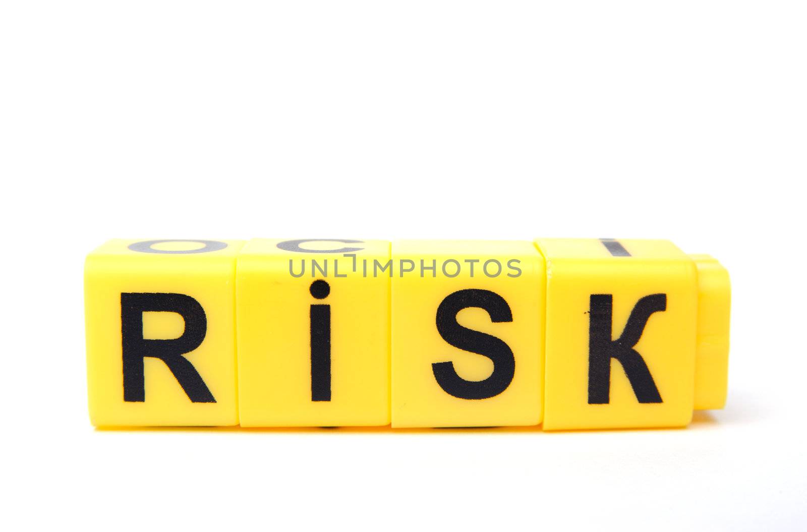 An image of yellow blocks with word ''risk'' on them