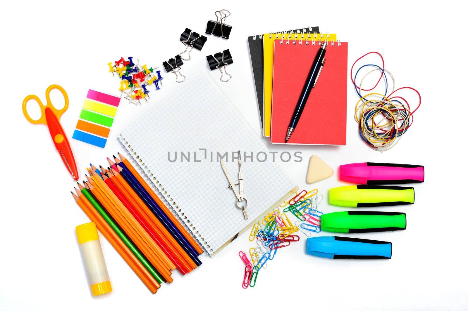 Notepad with stationary objects on white background