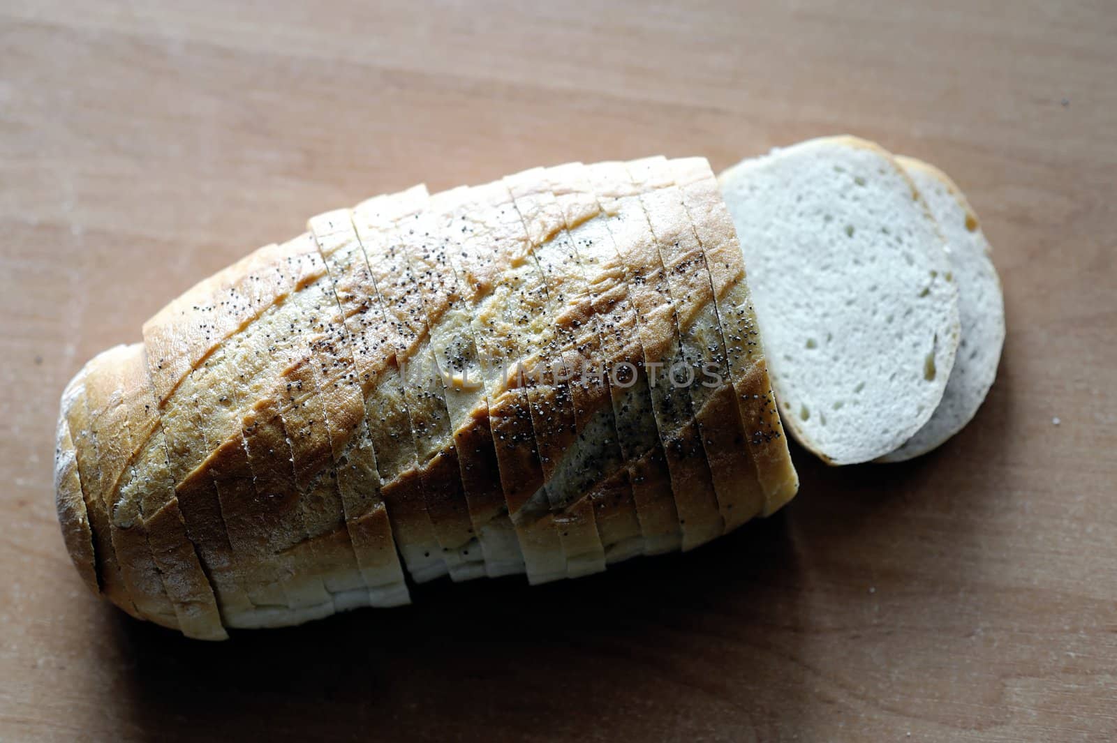 An image of a loaf of fresh white bread on the table