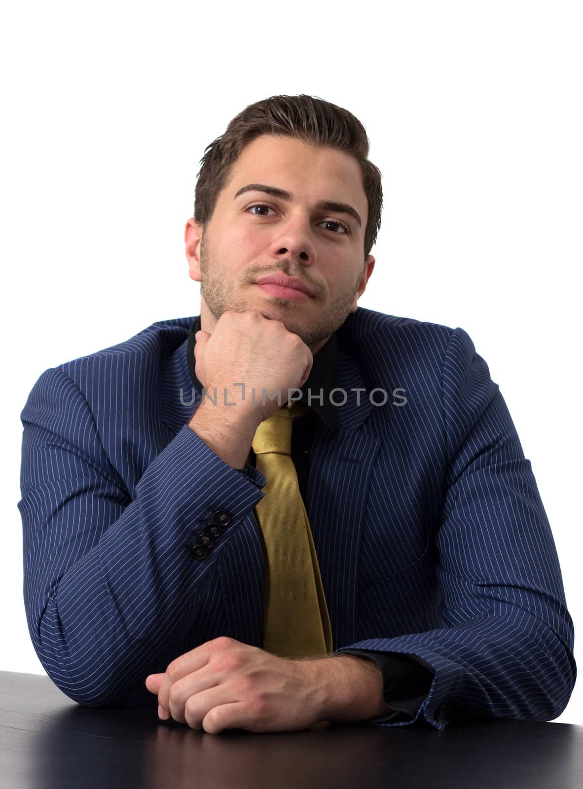 Thoughtful businessman in a blue suit with golden tie