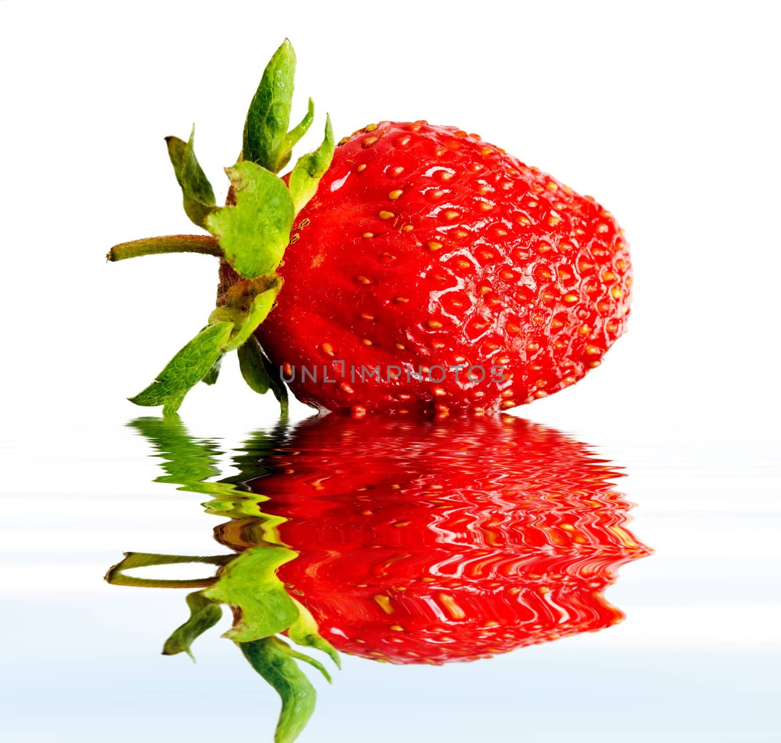 An image of red strawberry in water close up