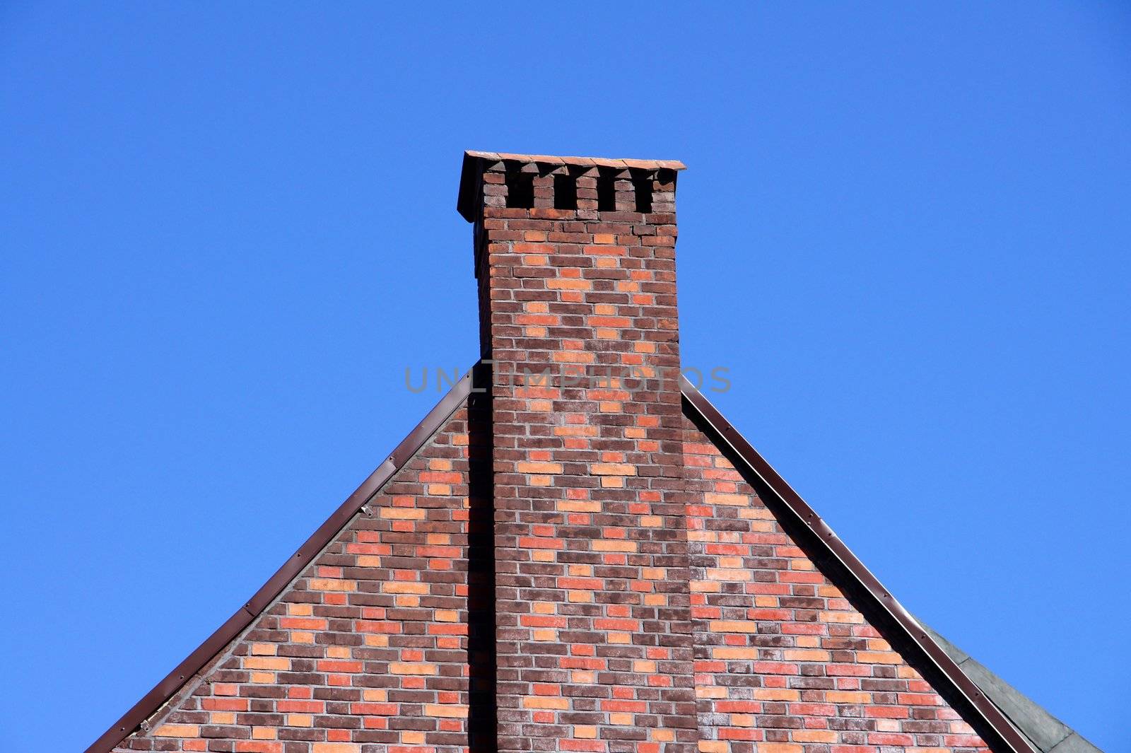 The wall and chimney with blue sky