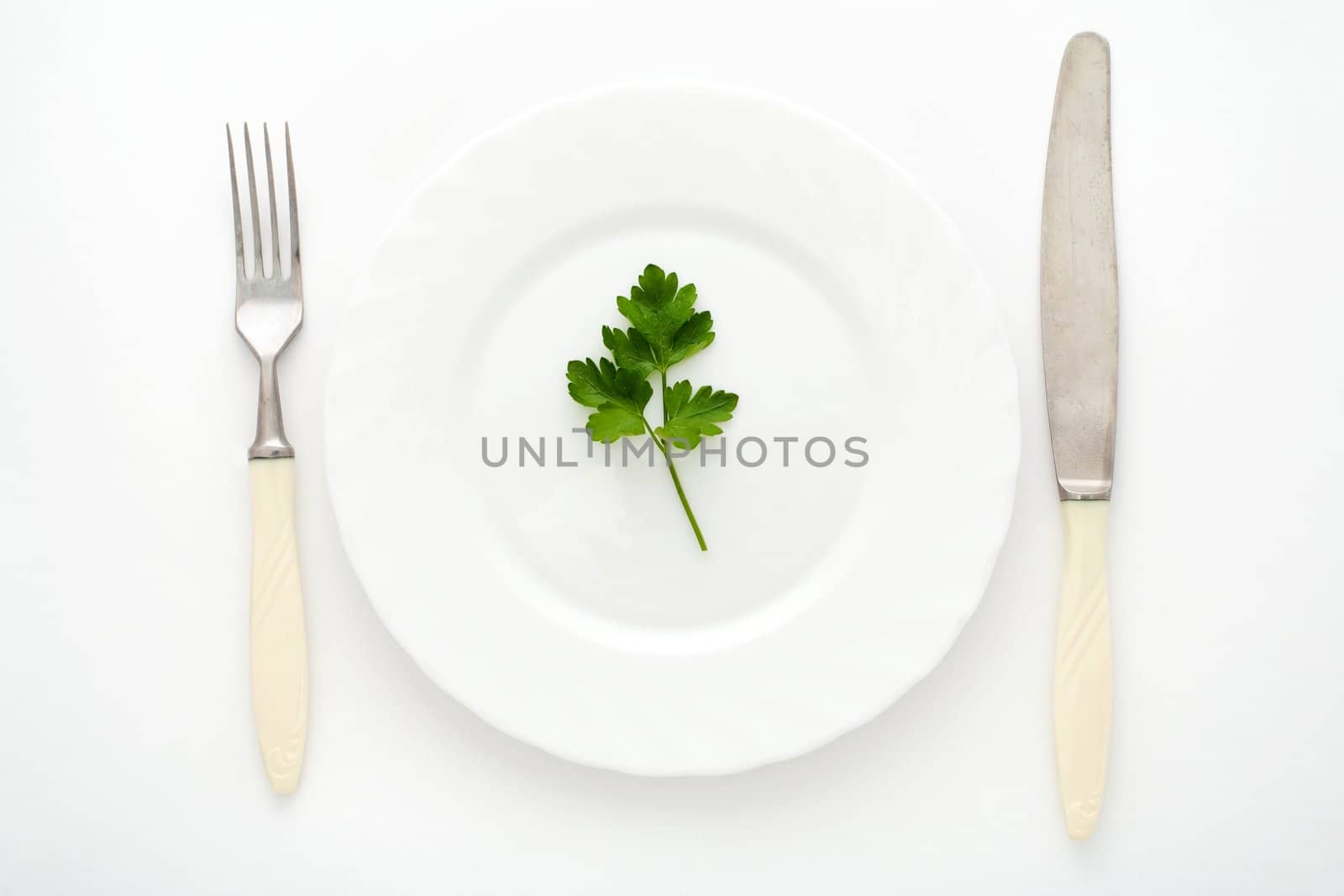 An image of fork, knife and plate