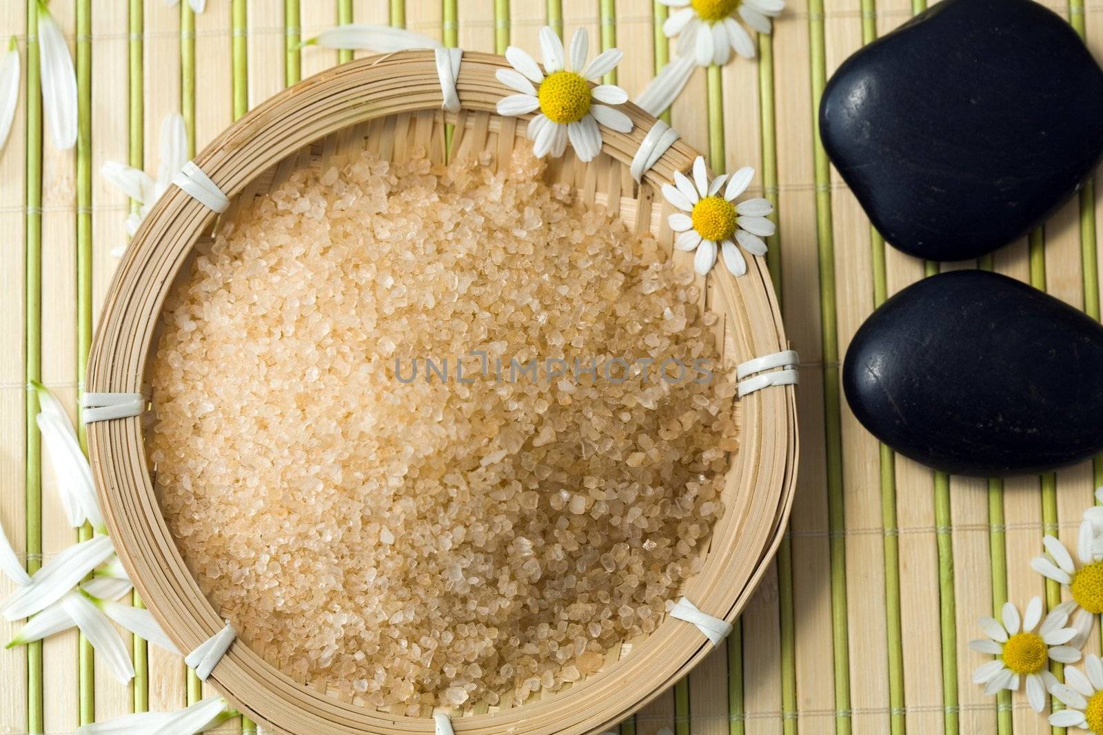 An image of bathing salt and stones for spa massage