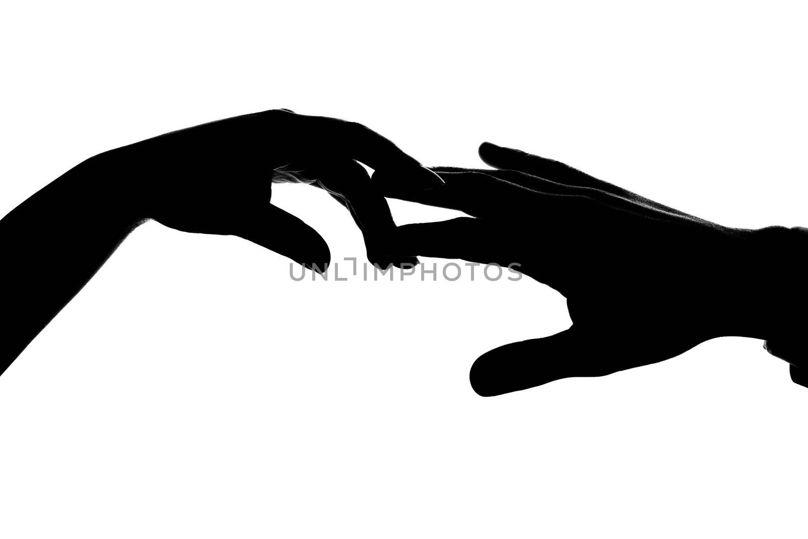 An image of silhouette of two hands. Man and woman.