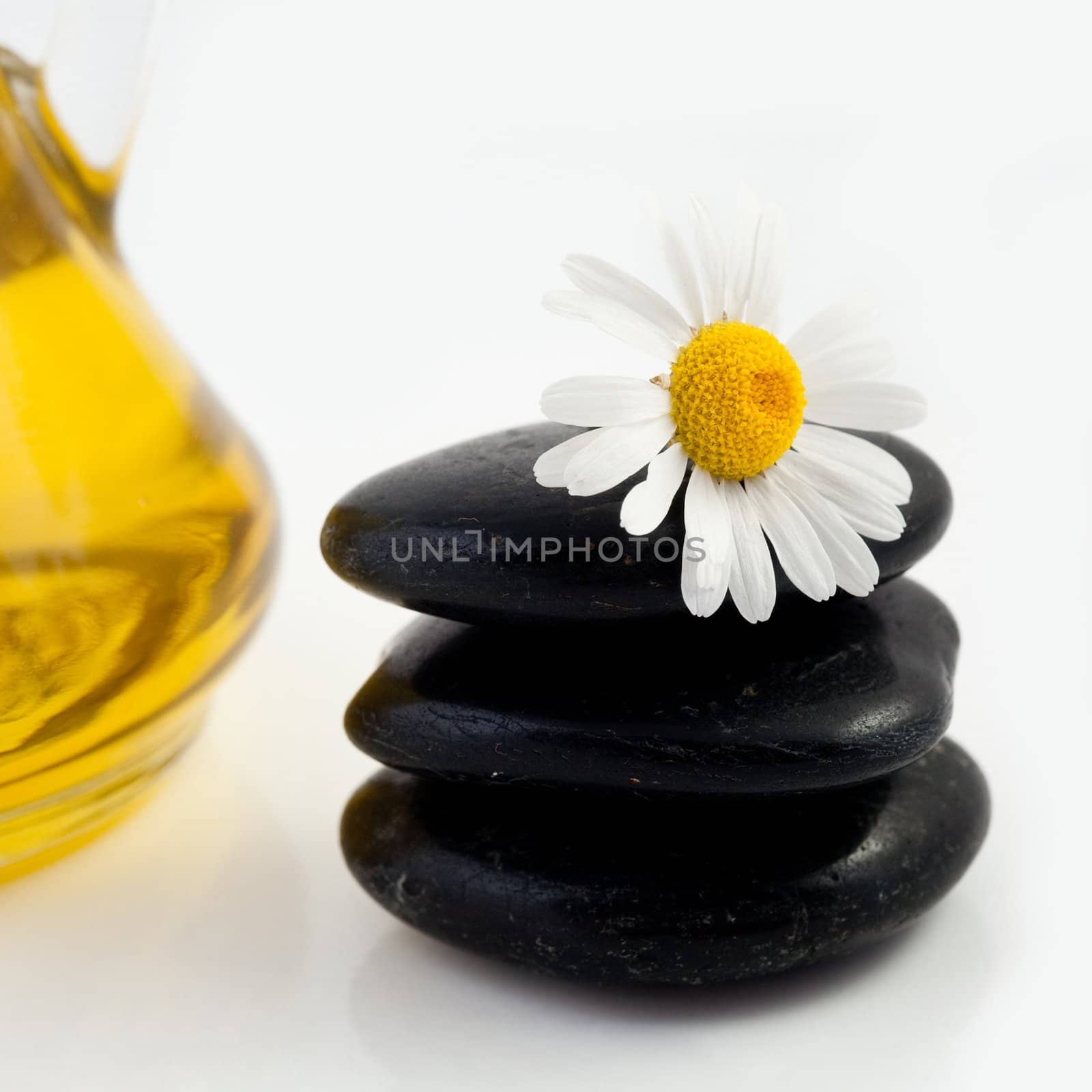 An image of a heap of black stones and flower