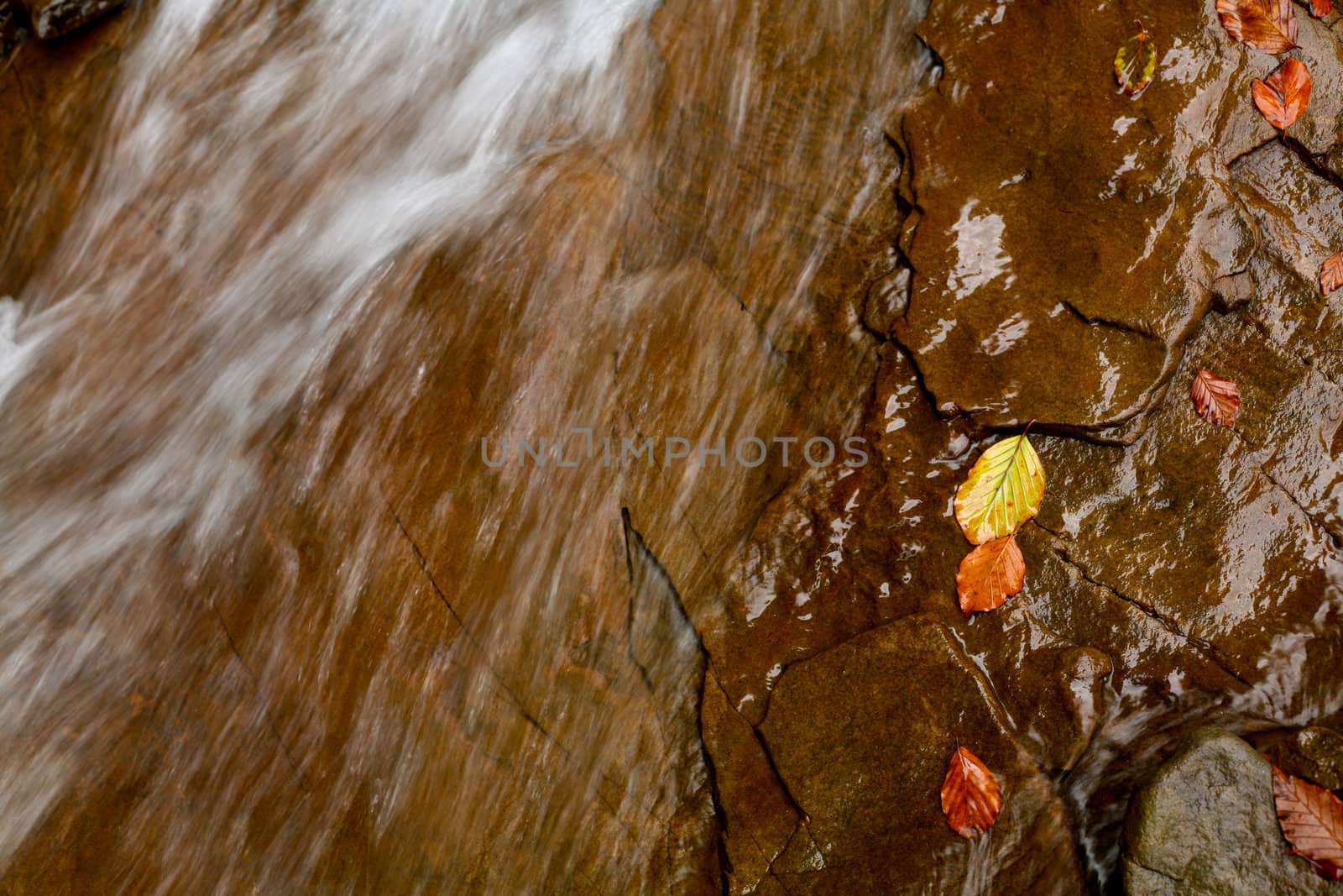 An image of falling river in autumn mountains