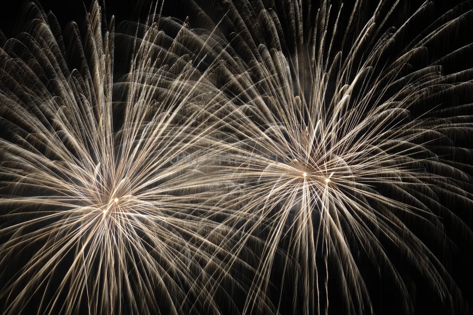 Stairs of fireworks against a black sky