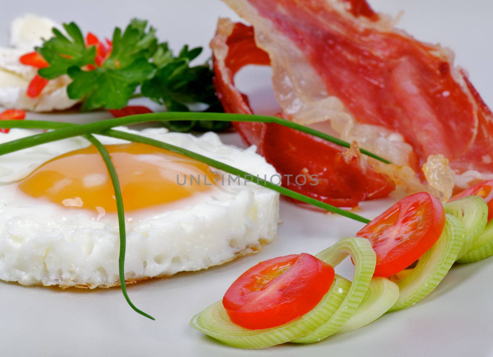Fried Eggs Sunny Side Up with greens and bacon by zhekos