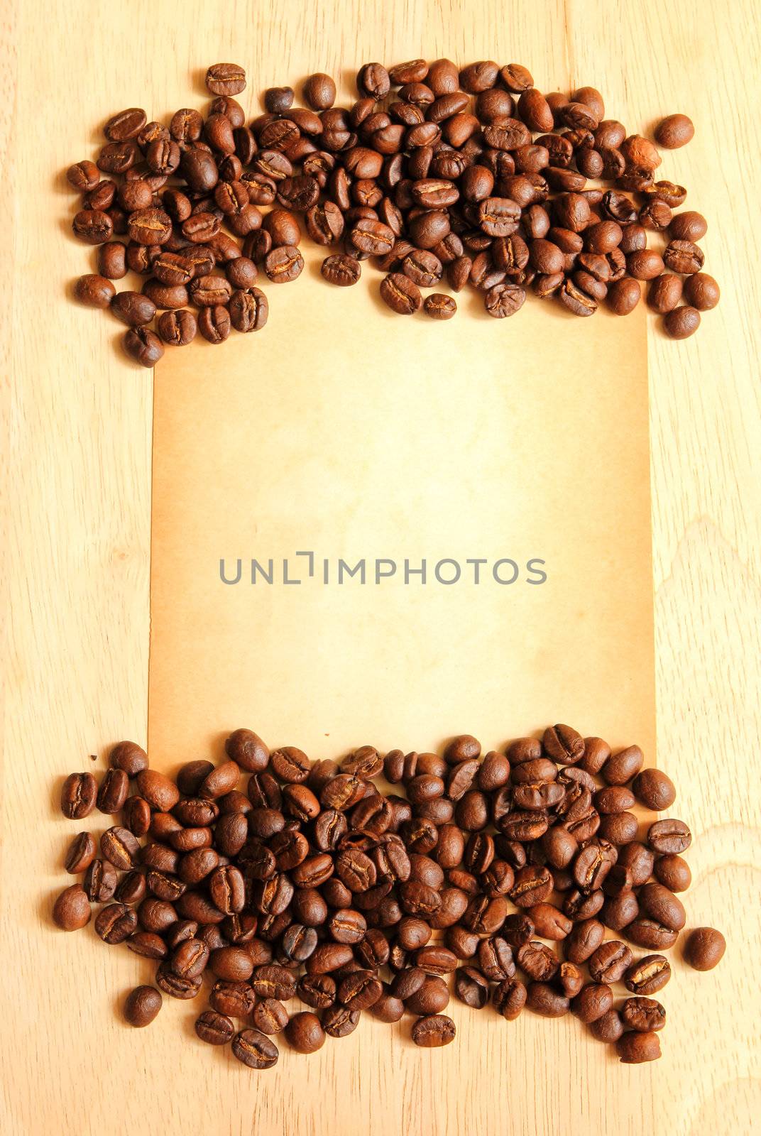 Coffee beans with old paper for notes on the wooden background by nuchylee
