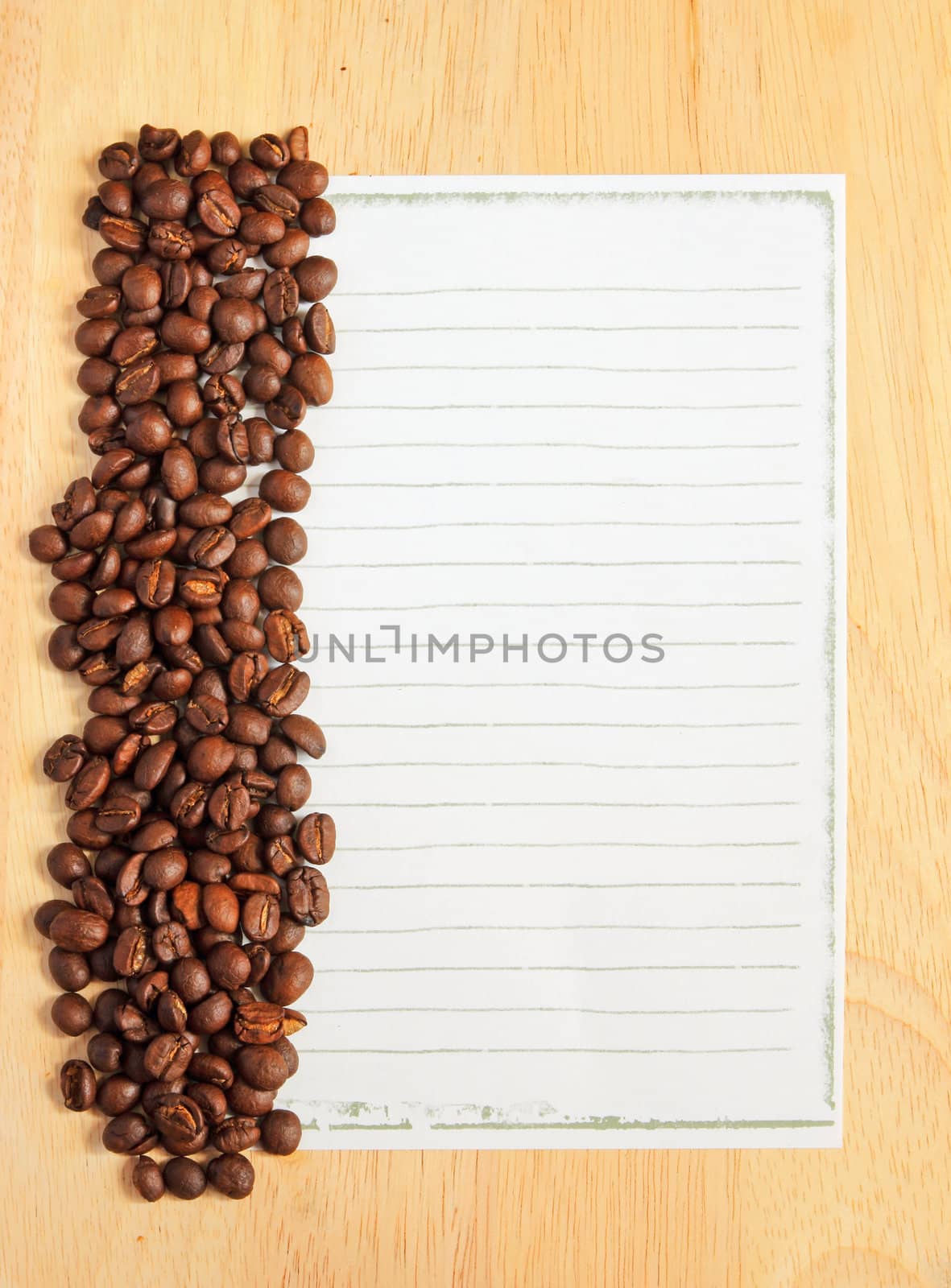 Coffee beans with paper for notes on the wooden background by nuchylee