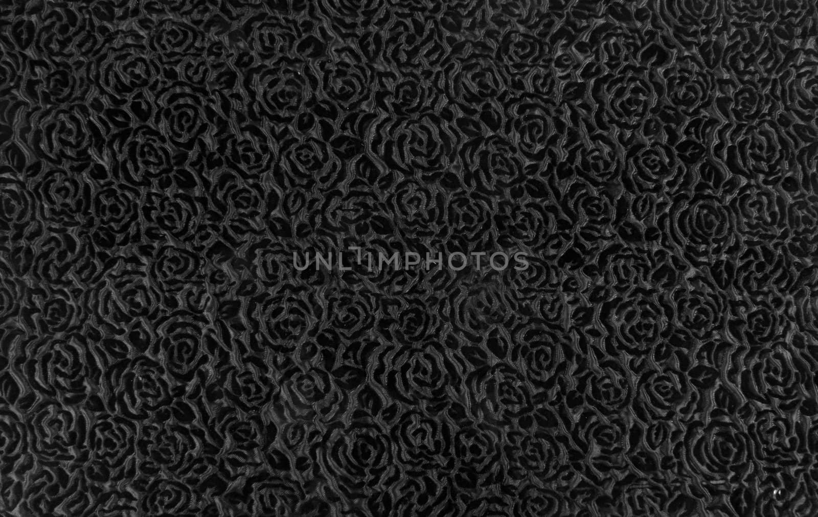 A background of a fabric with an abstract gray design.