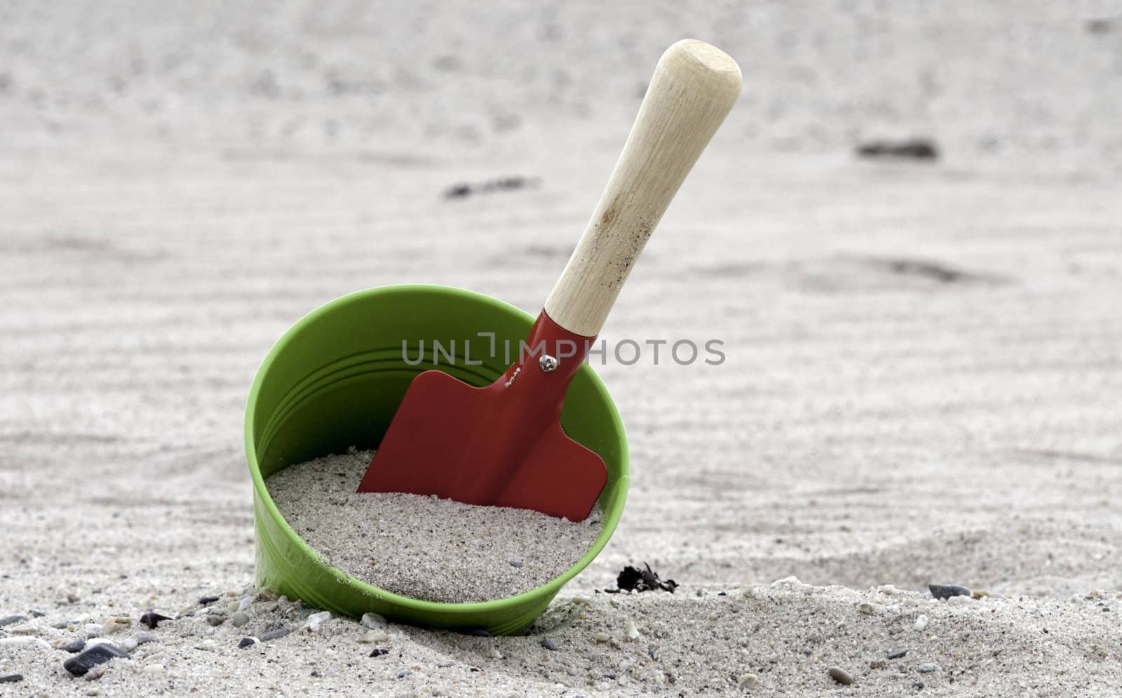 shovel and bucket on the beach by compuinfoto