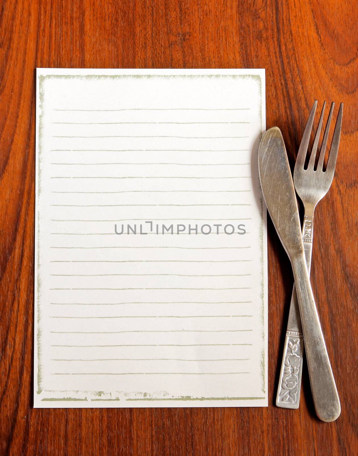 paper for menu with knife and fork on wooden background by nuchylee