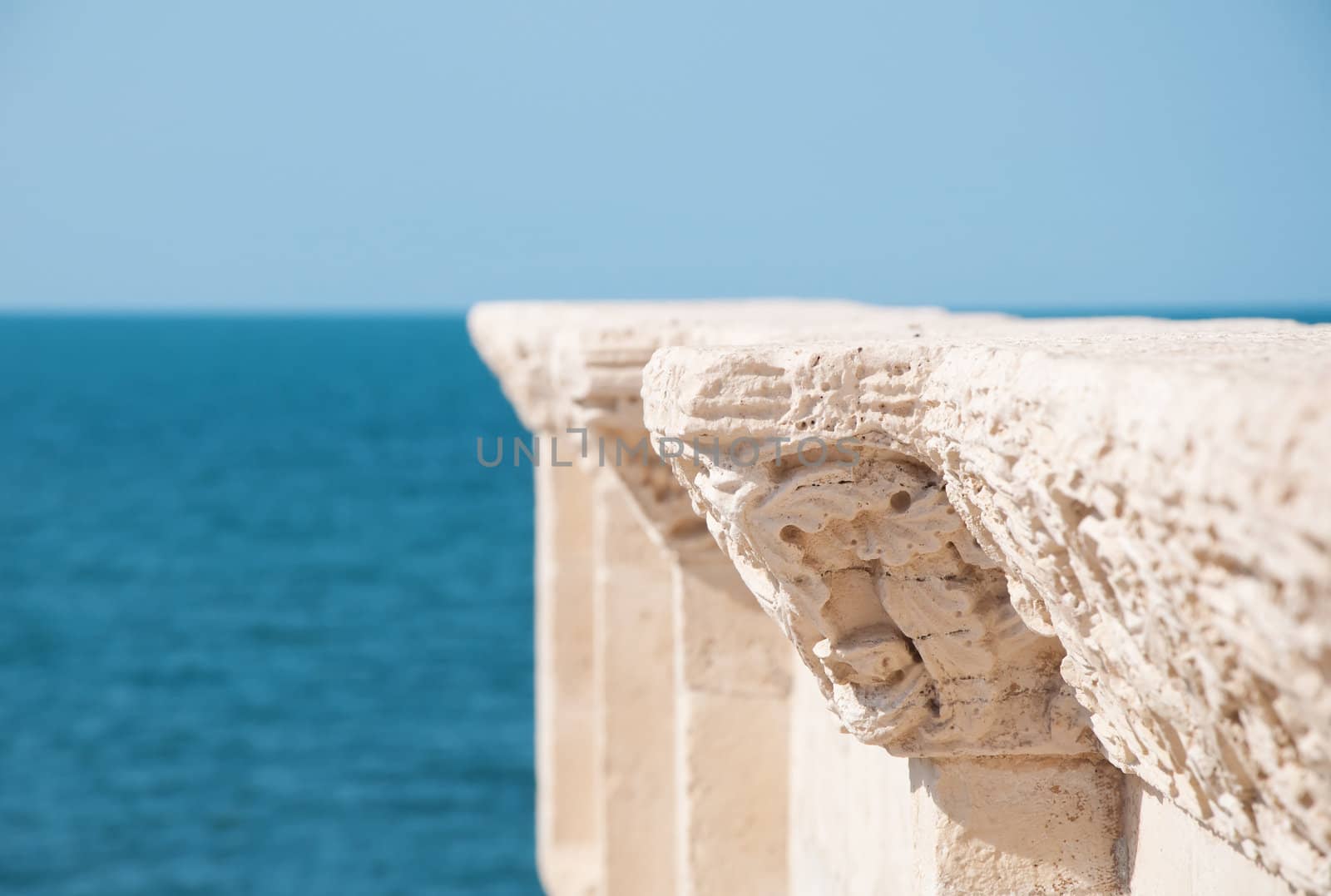 detail of old architecture and blue sea background