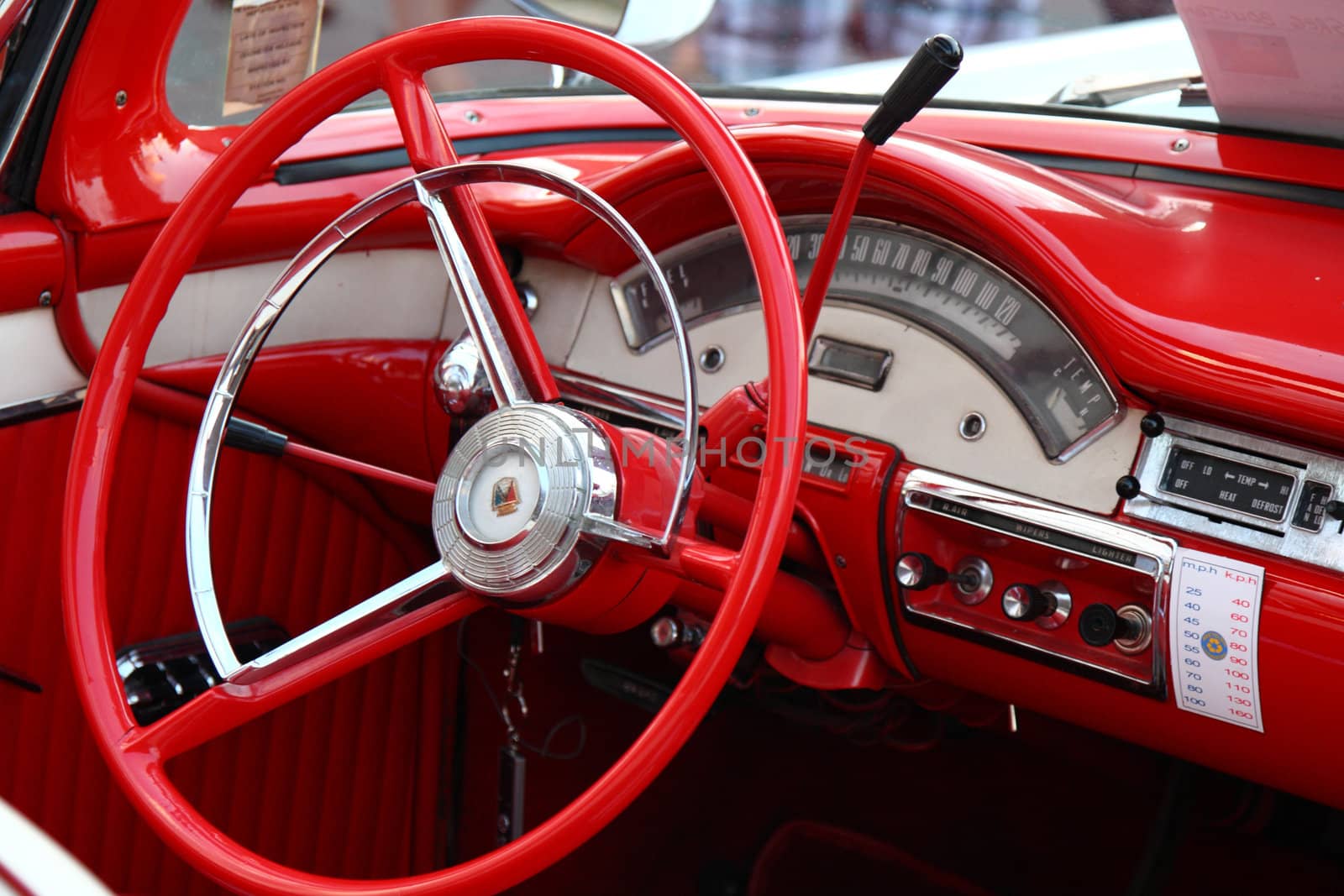 steering wheel and dashboard interior of vintage classic car by njene