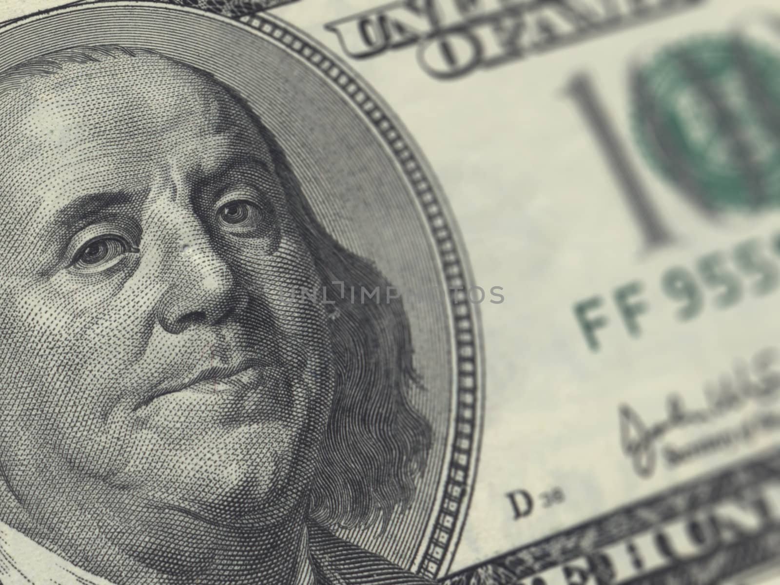 Close up to one hundred dollar bill with depth of field.