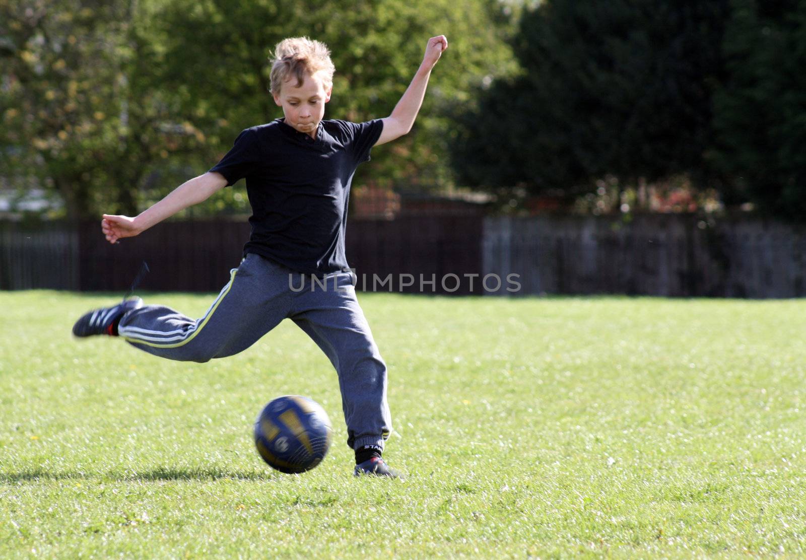 teenage boy enjoying a game of football