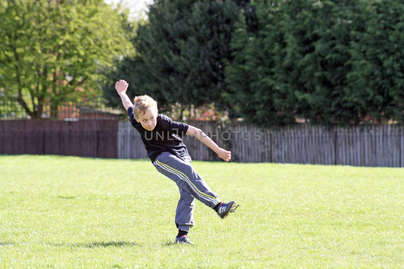 teenage boy enjoying a game of football