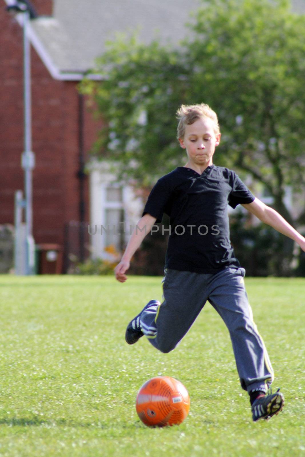 teenage boy enjoying a game of football