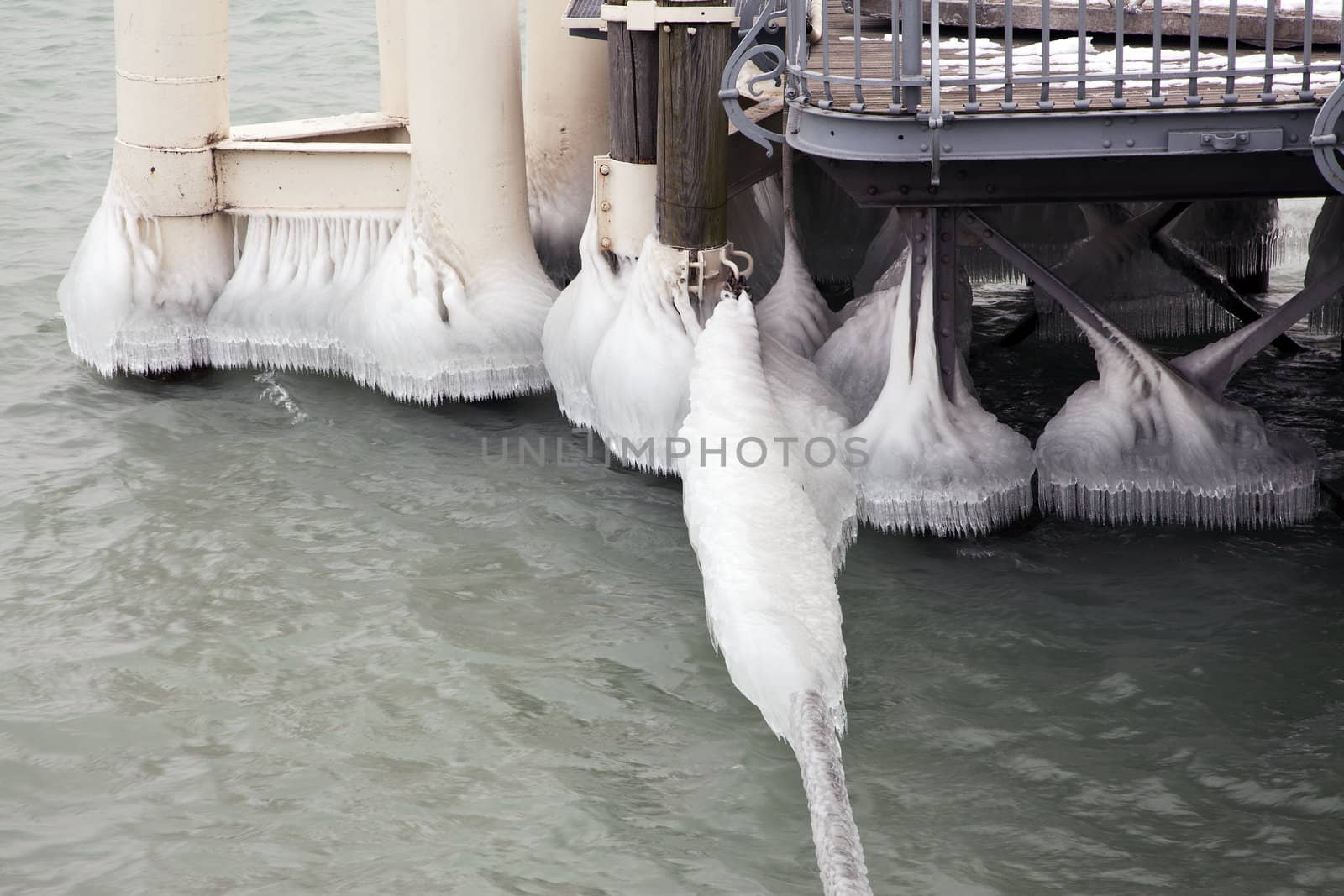 Heavy winter weather deposits ice on moorings in the water