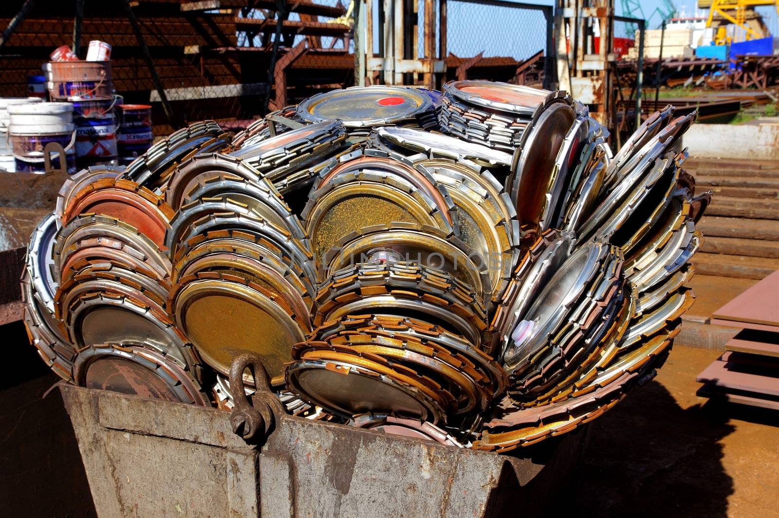 The scrap metal is combined in the container for transportation