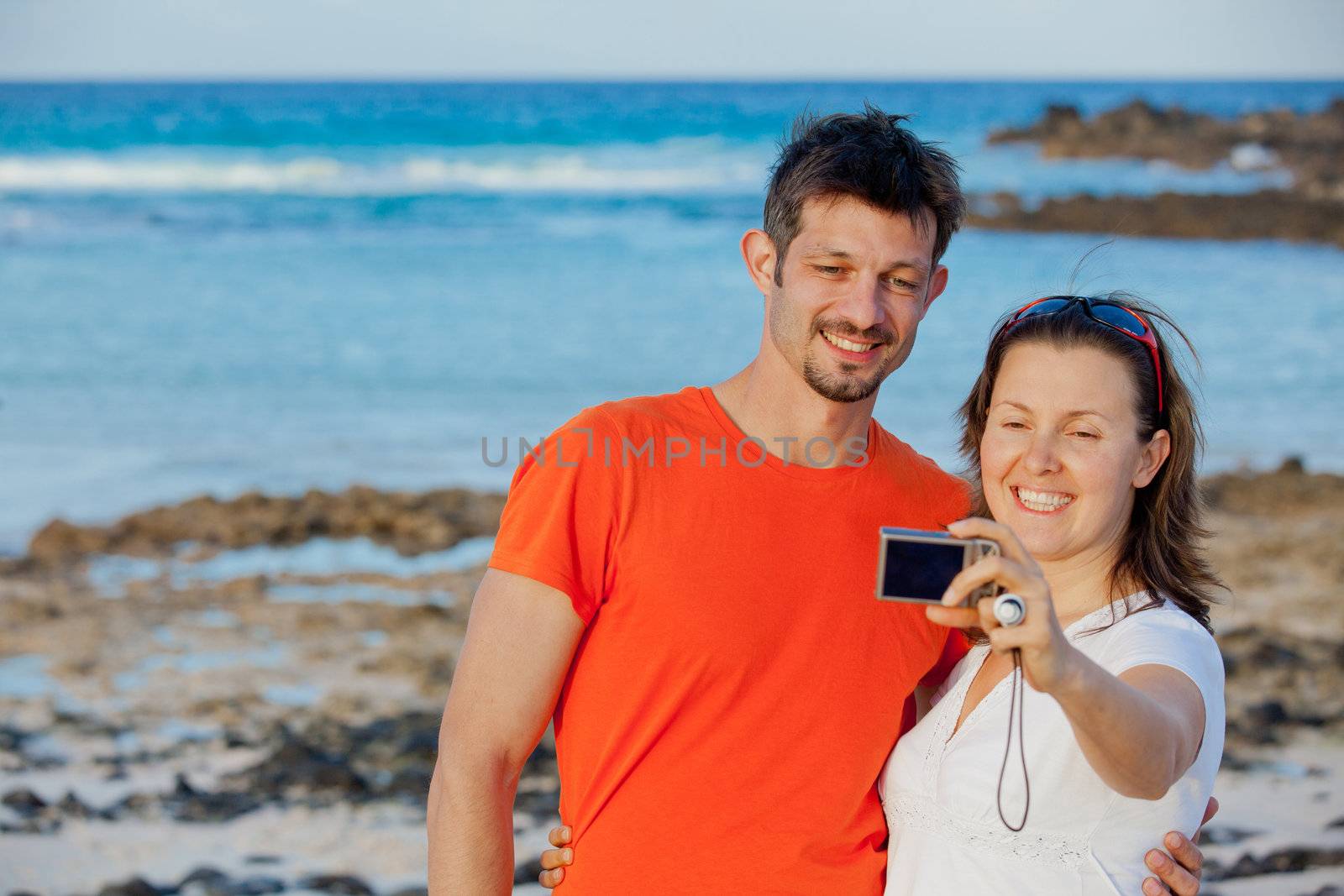 Two young girls taking a self portrait with a camera