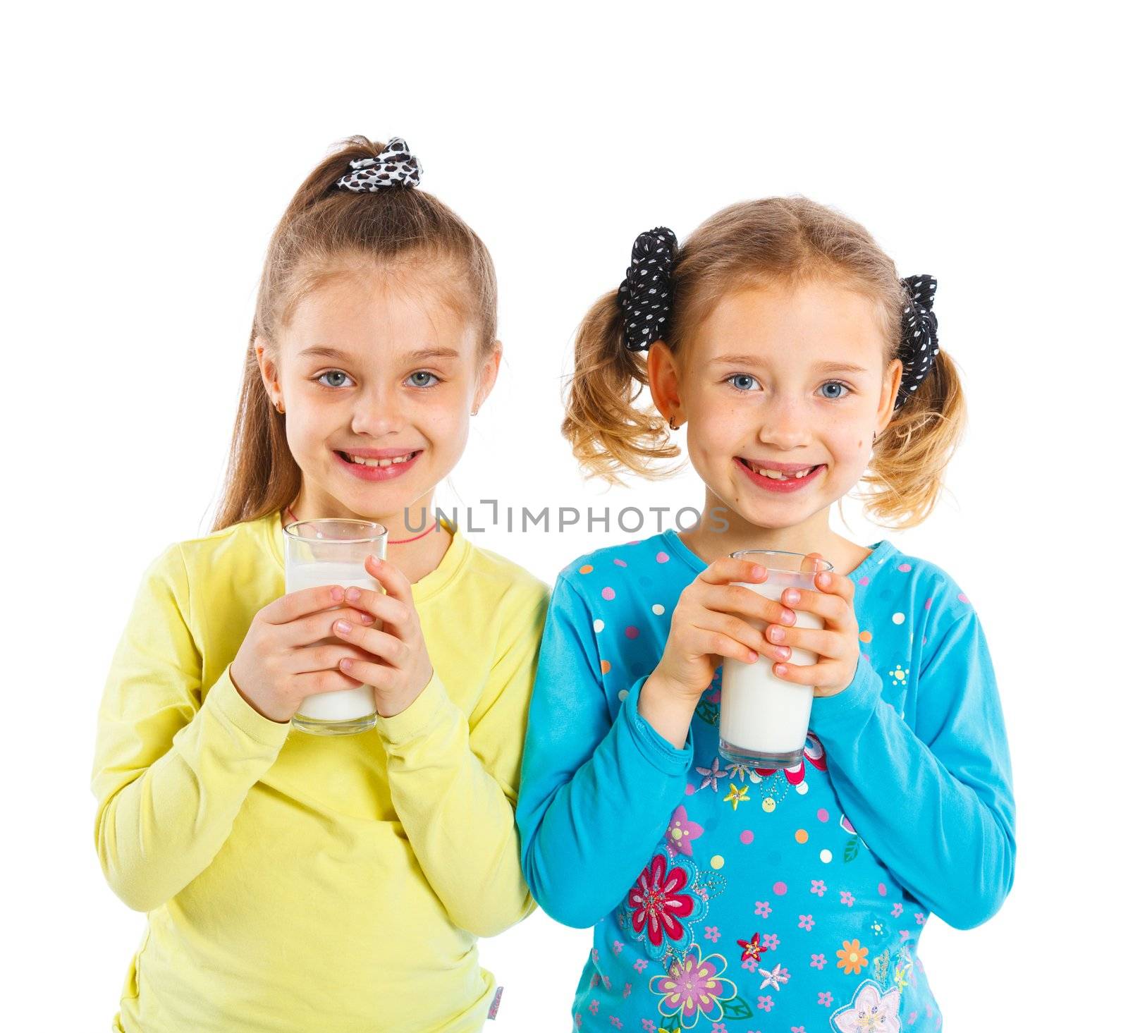 Portrait of happy girls with milk mustache, isolated on white.