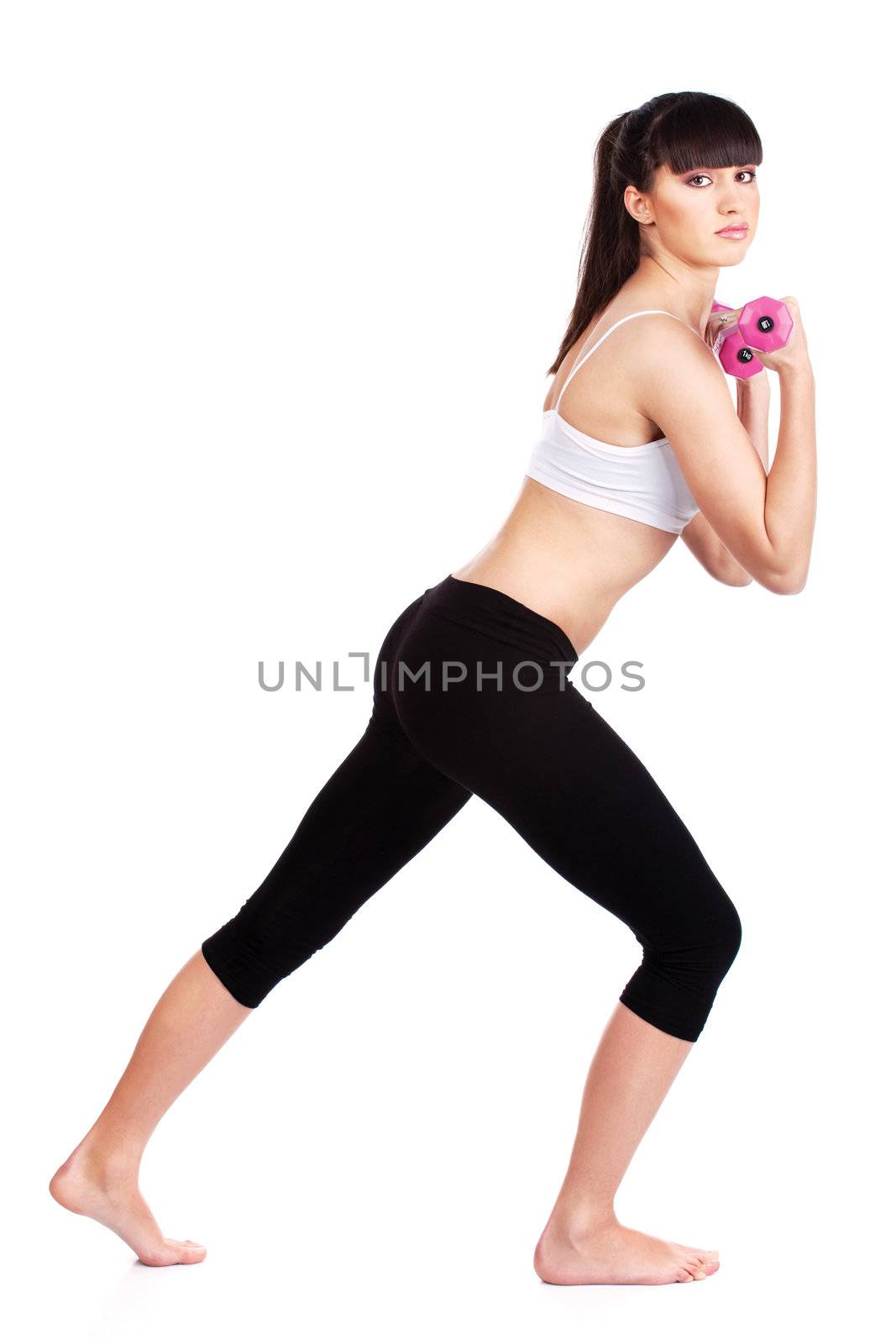 Young woman doing fitness exercises with two weights, isolated on white