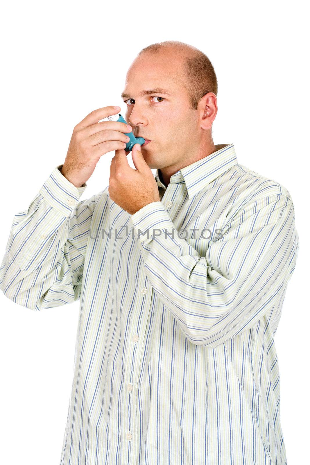 Man holding asthma medicine inhaler with both hands by imarin
