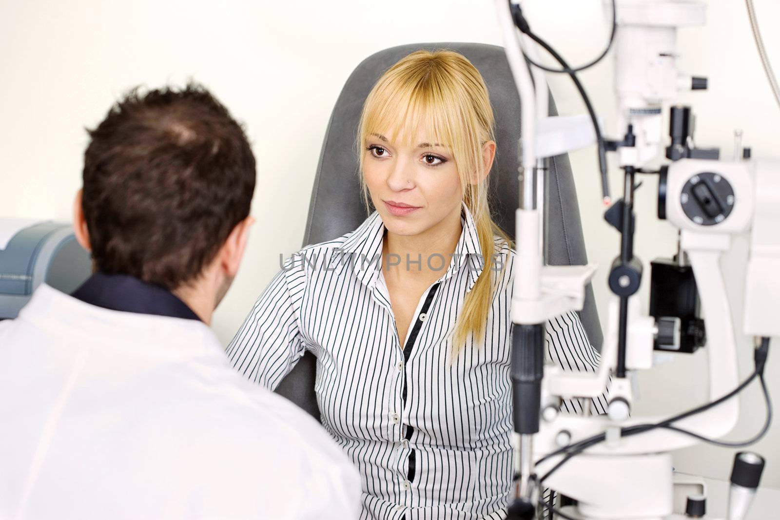 Female patient listening diagnose after medical attendance at the optometrist