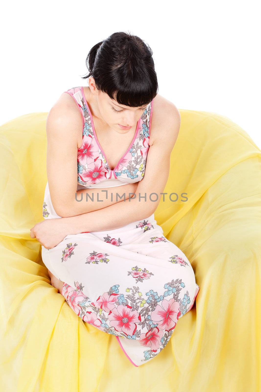 Girl in pain holding hands on stomach, isolated on white background