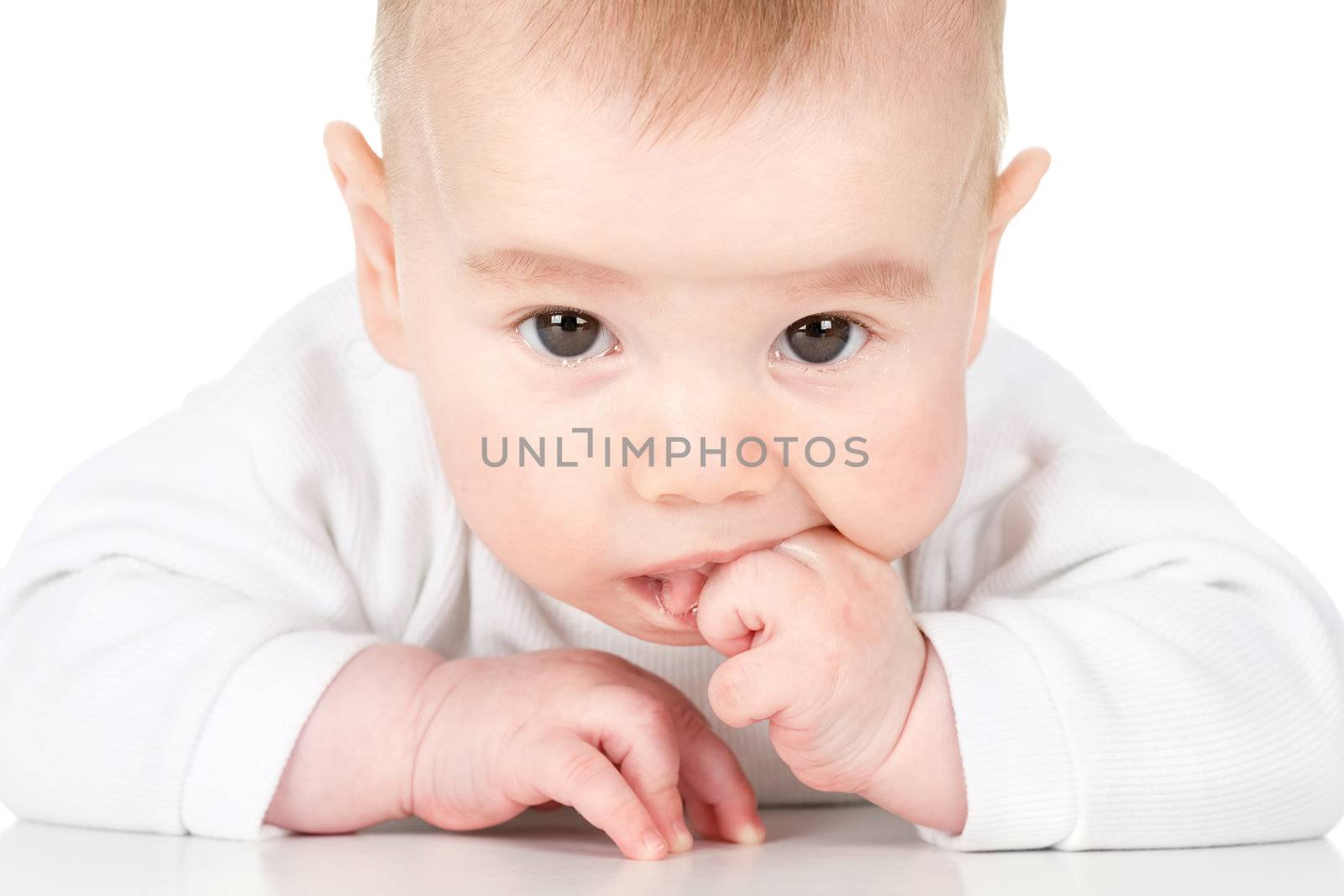 Baby is posing with fingers in his mouth, Isolated on white background