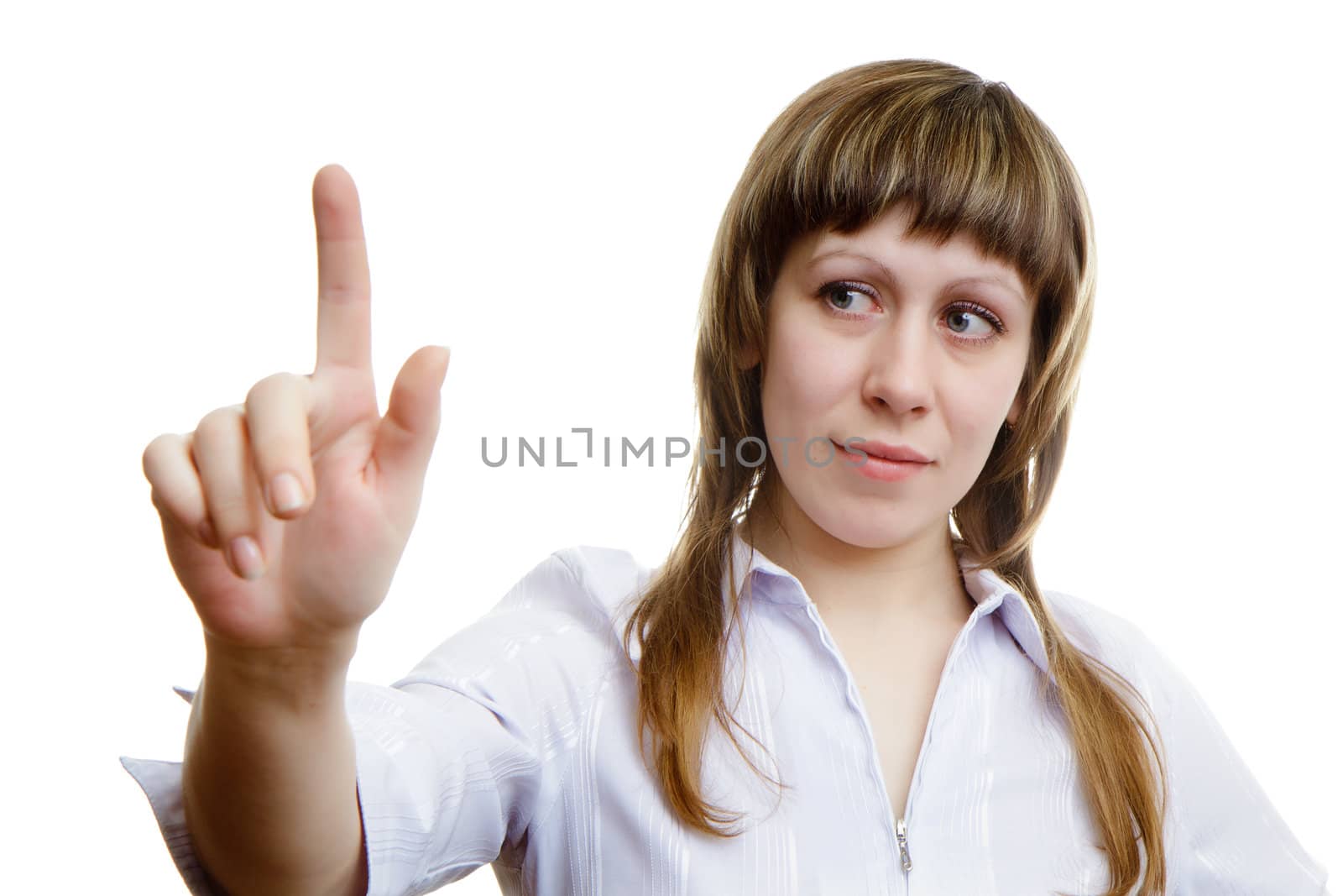 young girl pushes imaginary button on a white background