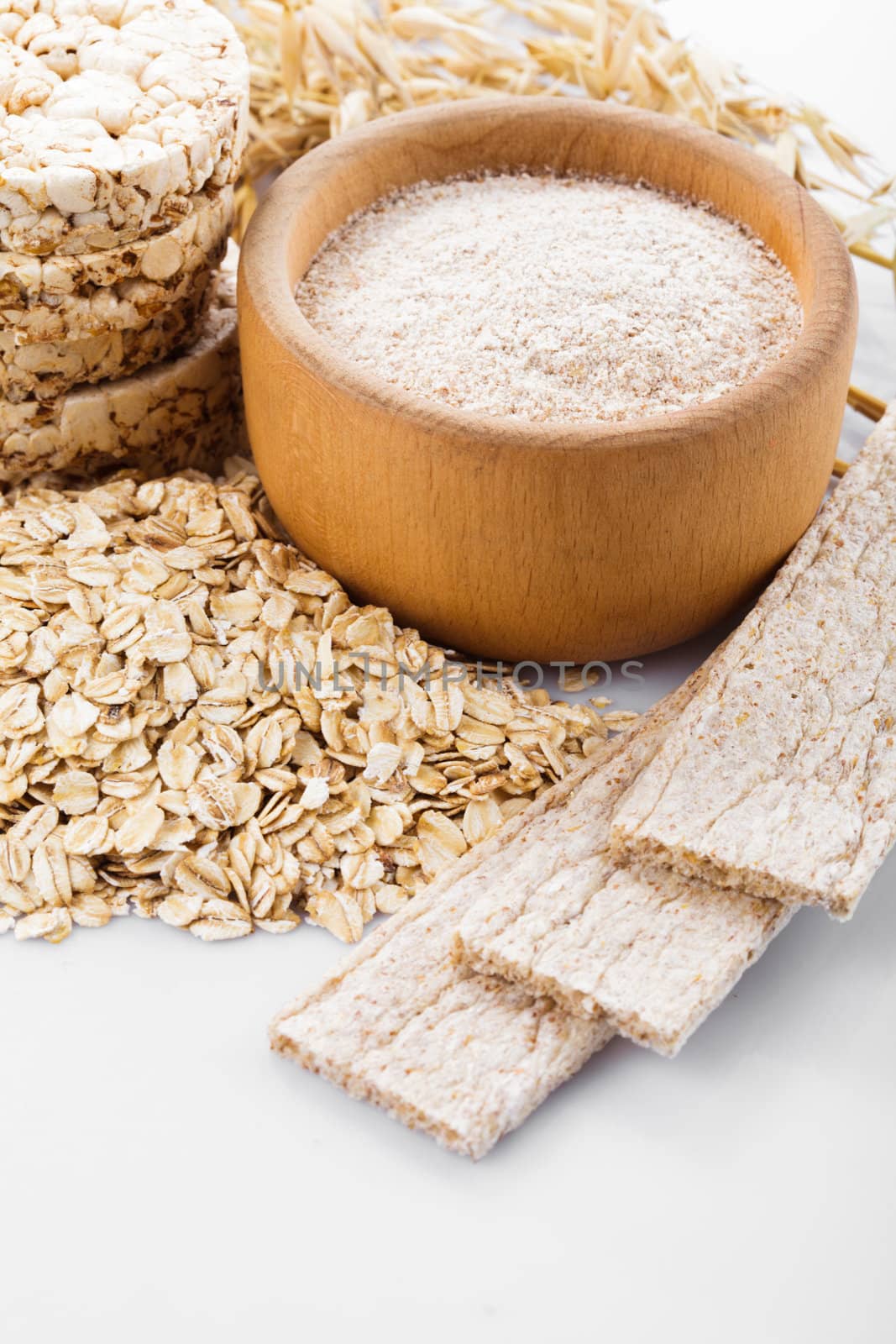 Various dietary oat products on white background