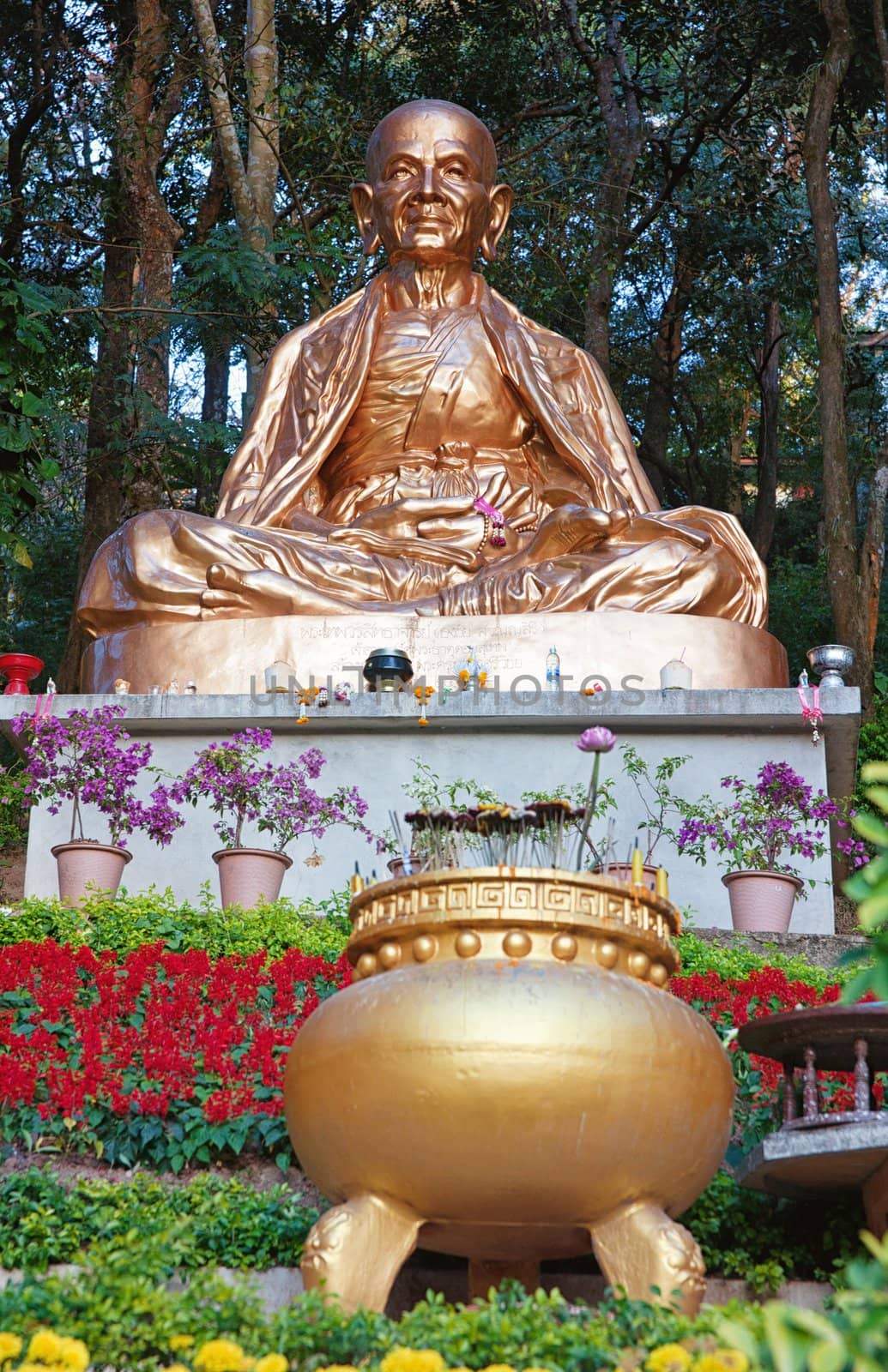 golden sitting buddha statue in chiang mai thailand