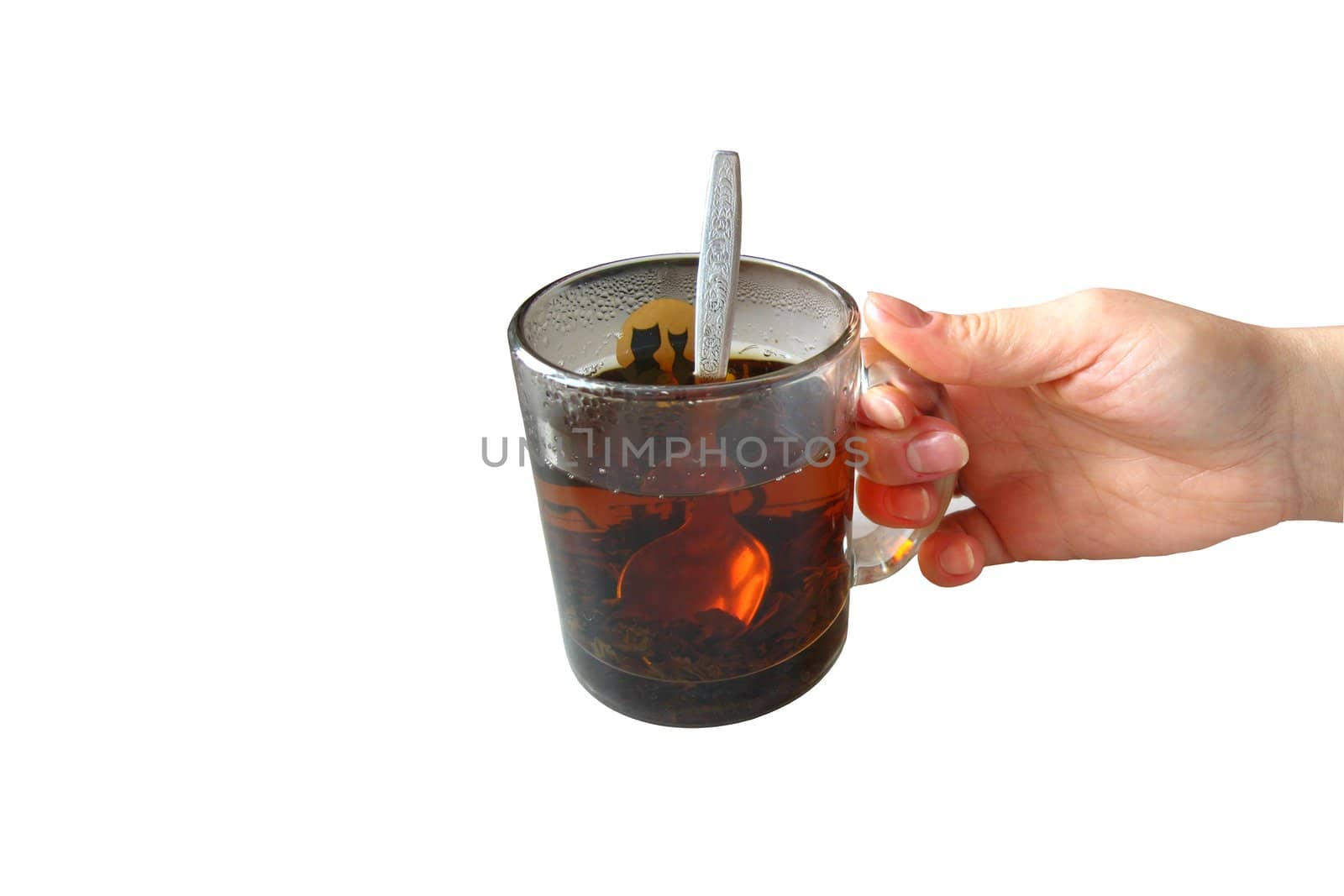 Hand with a cup of tea on a white background