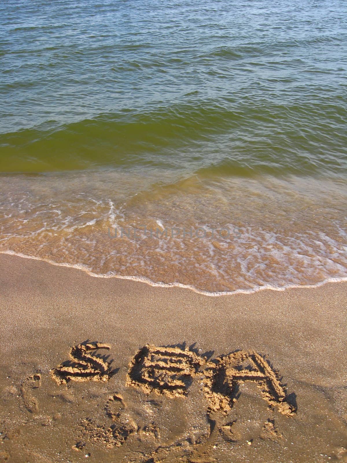 panorama of the sea waves and inscription on thr sand