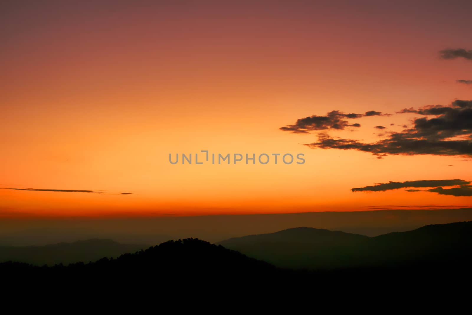 An image of a sunrise in mountains