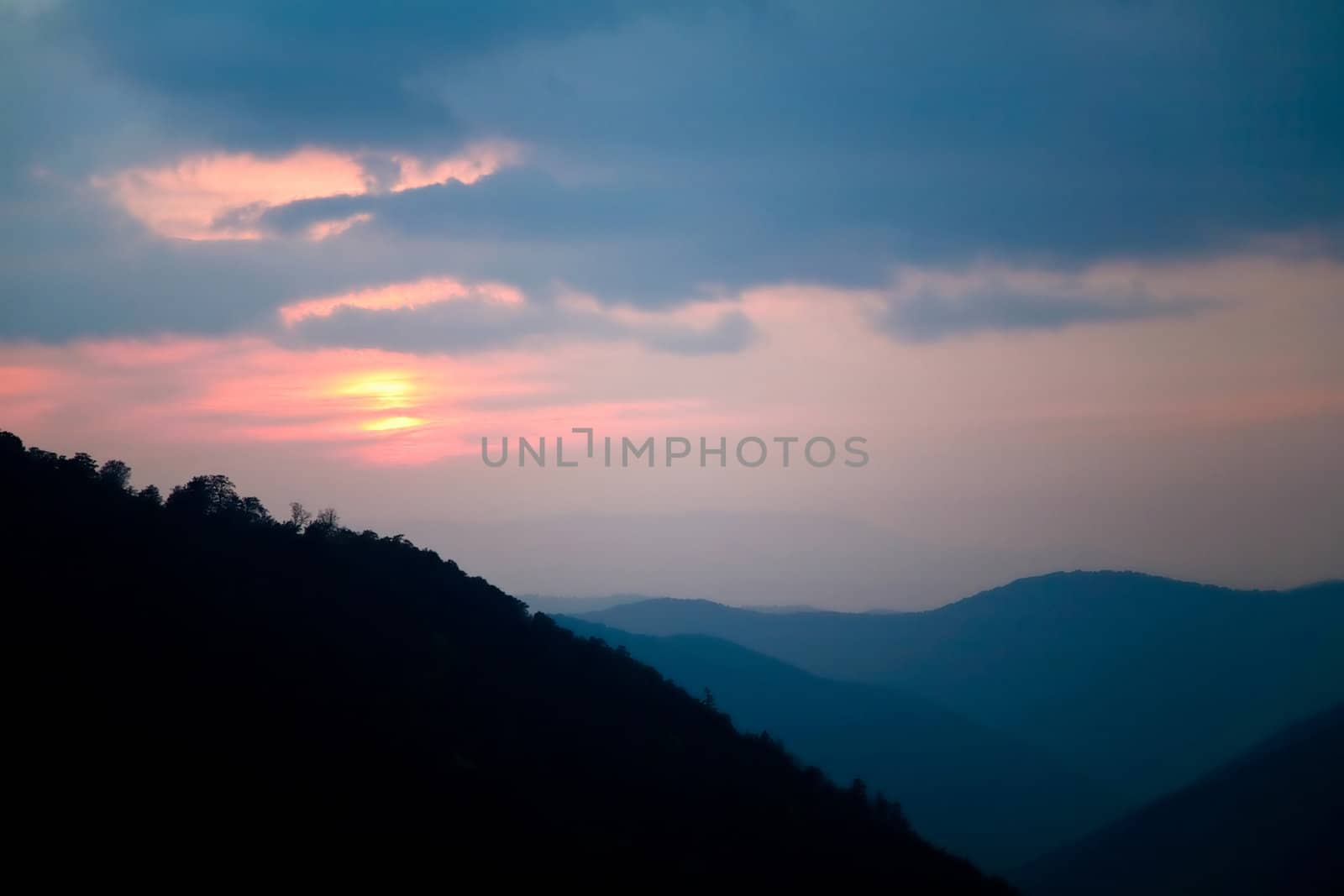 An image of a sunset in the mountains