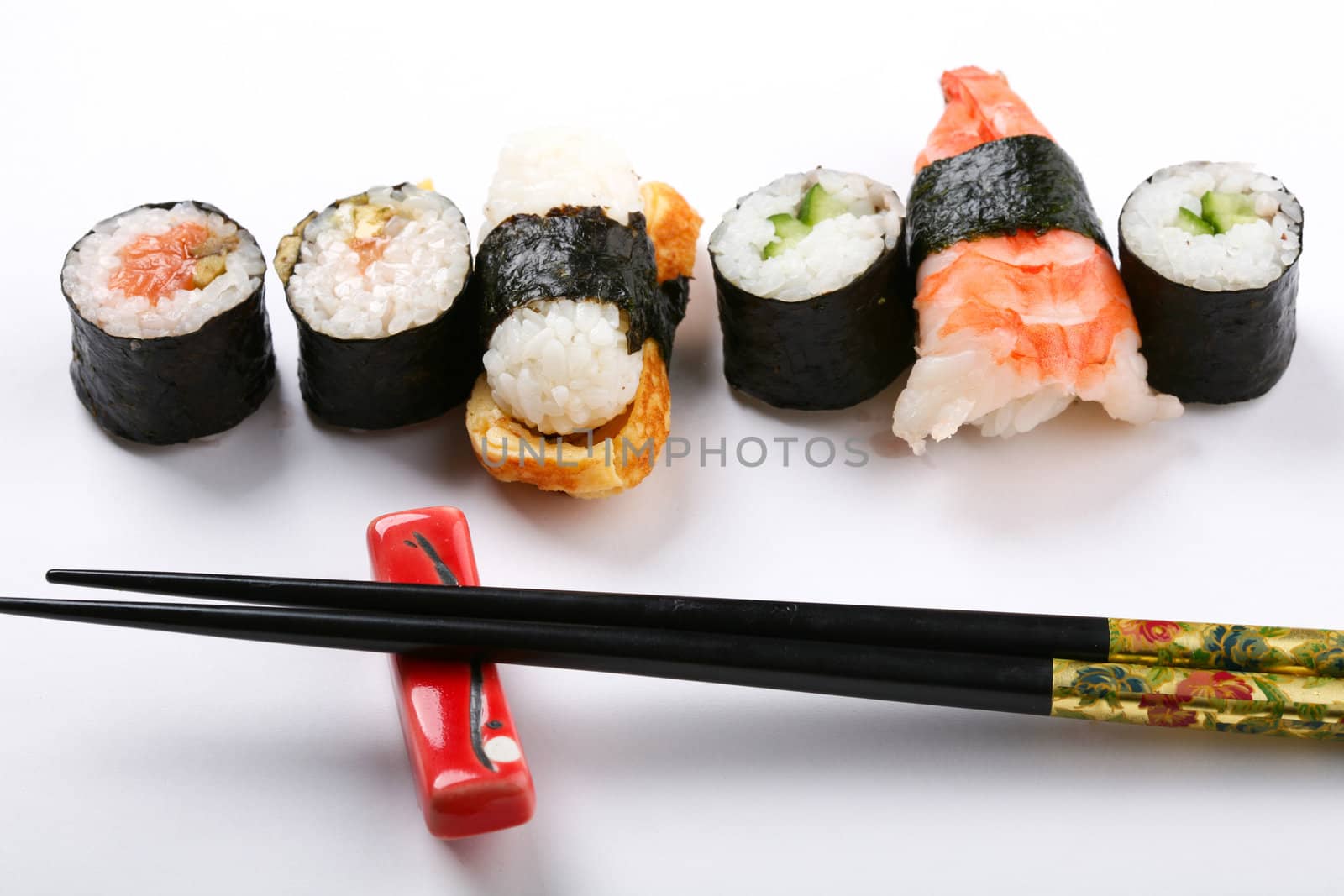 Stock Photo: Asia and food: prepared sushi on white