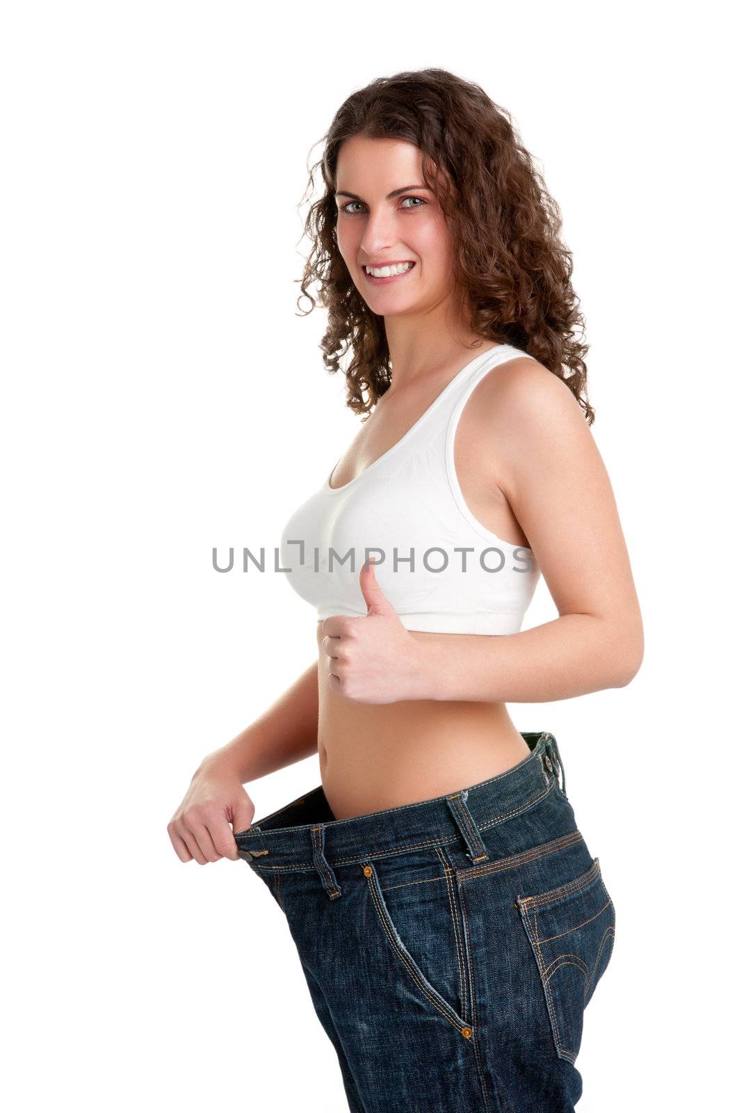 Woman seeing results from her diet and giving a thumbs up, isolated in white